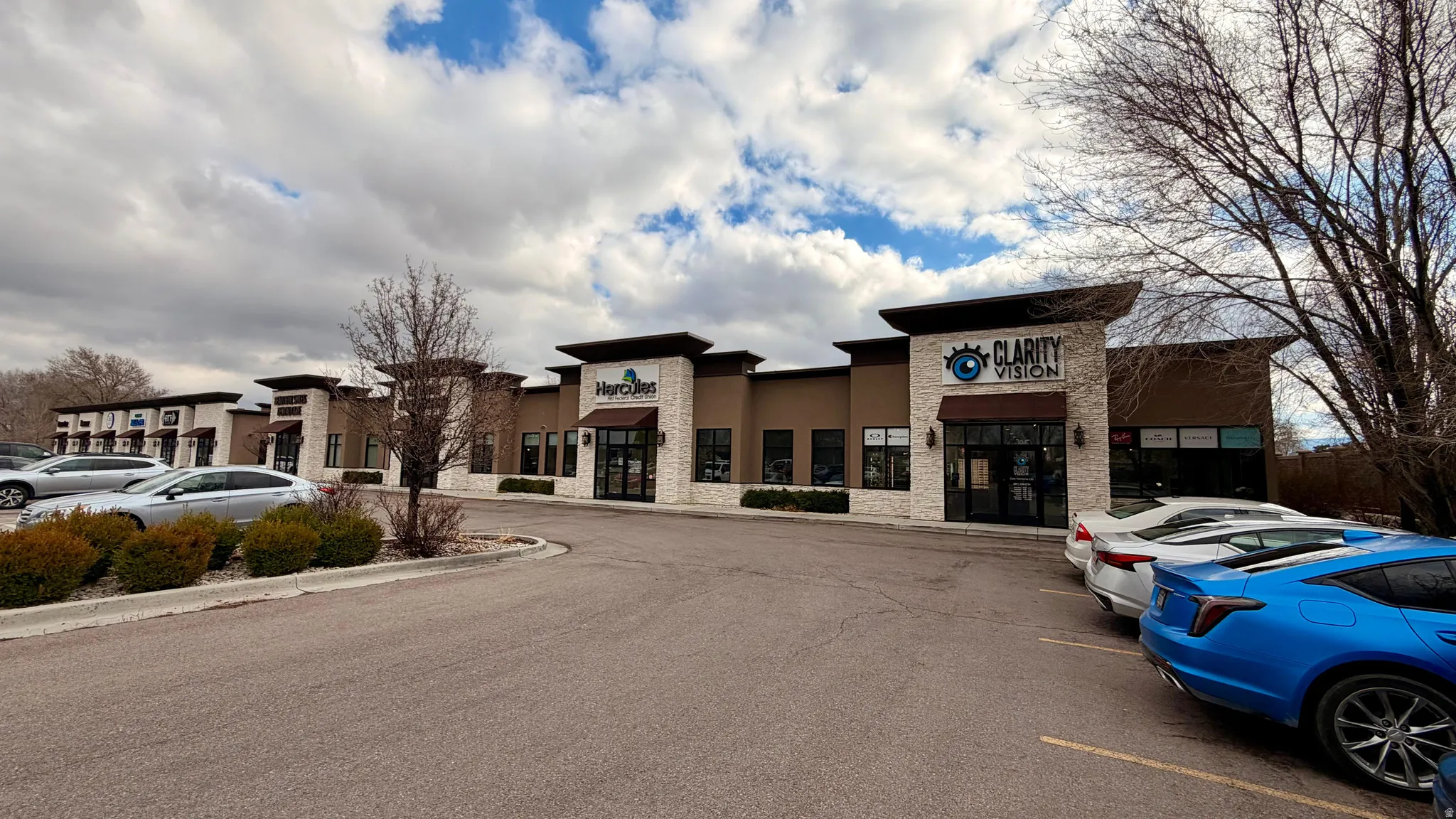 View of commercial location featuring uncovered parking