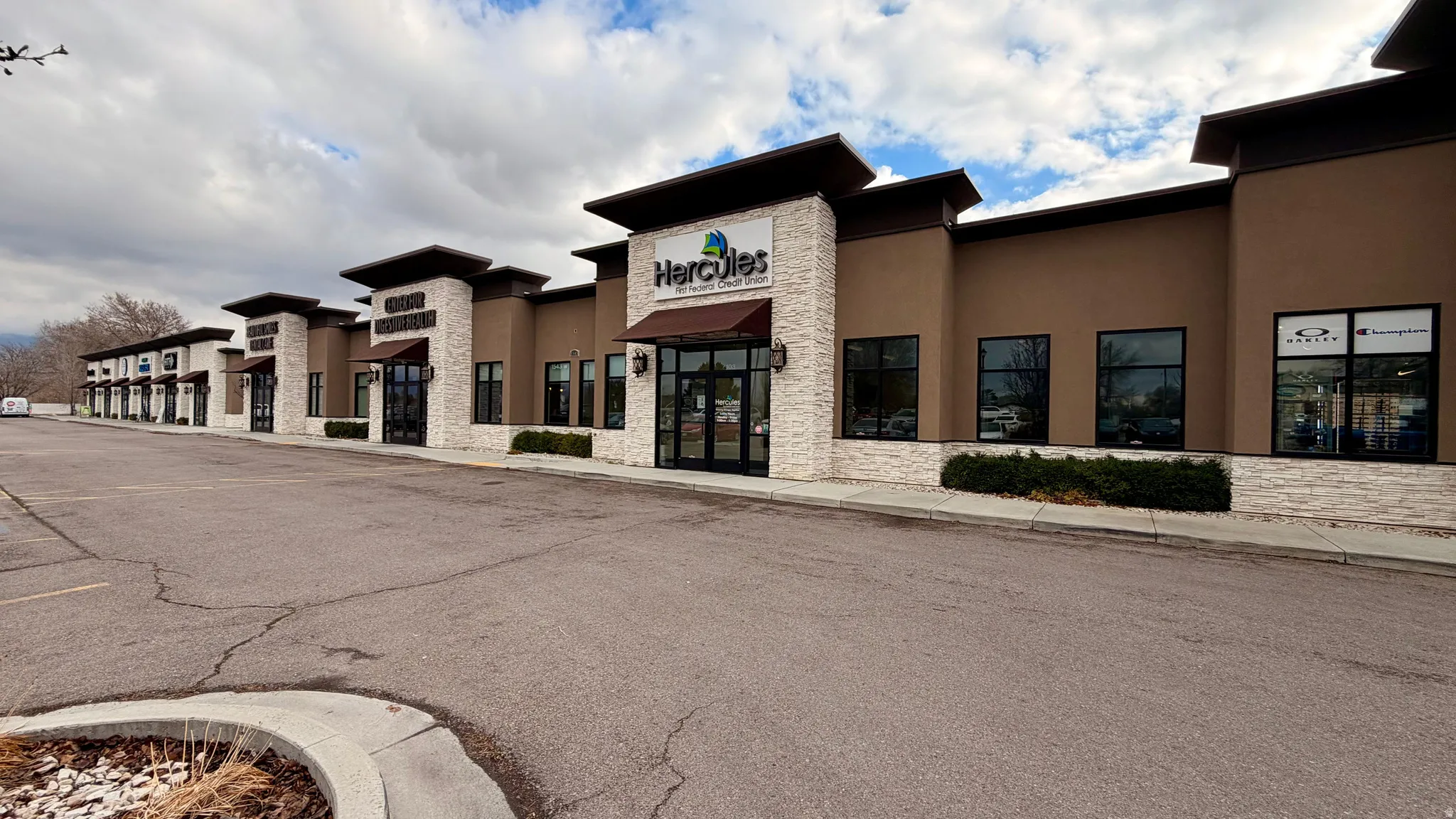 View of commercial location with uncovered parking