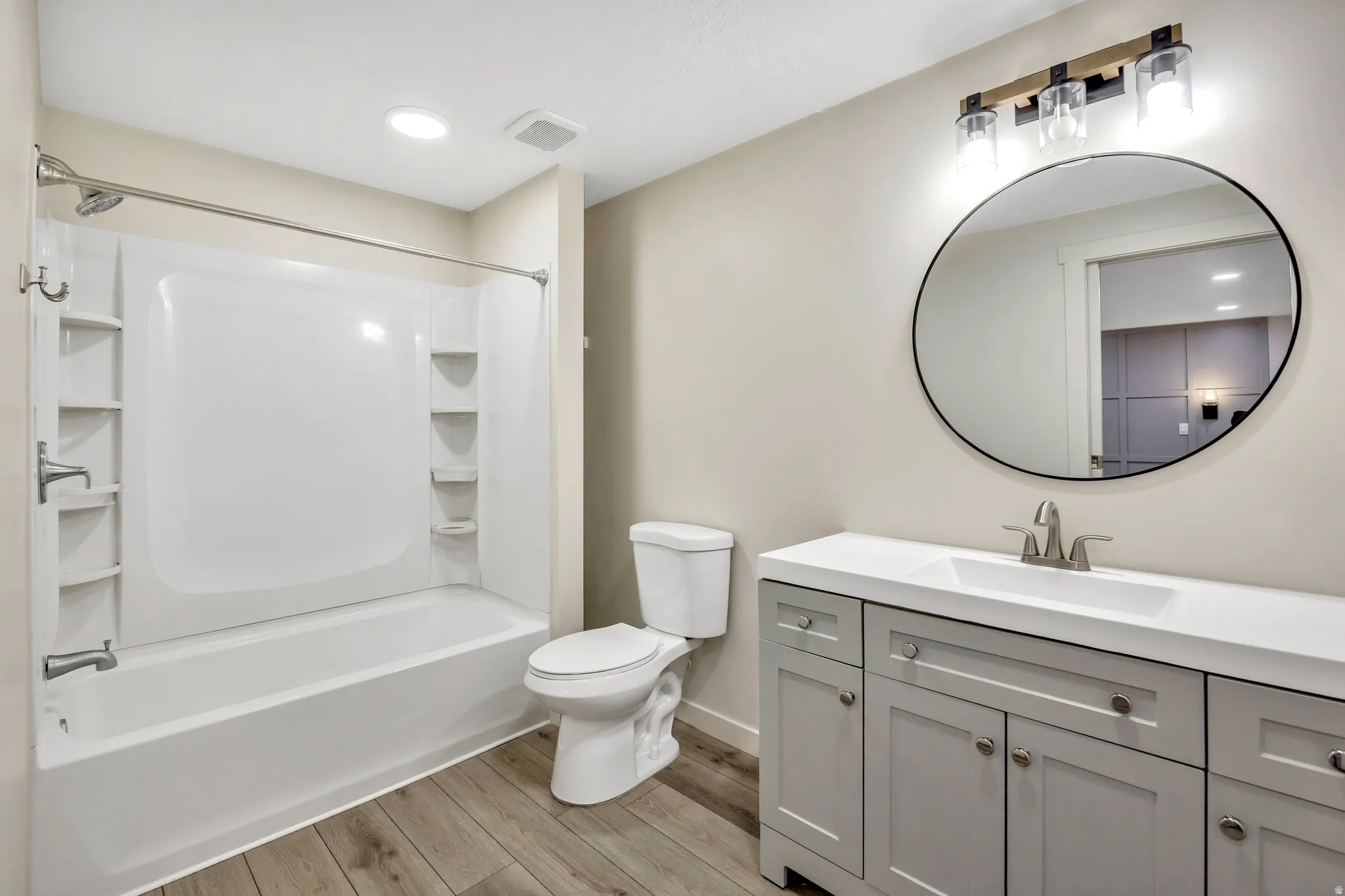Full bath #3 (Basement) featuring vanity, recessed lighting, light wood-type flooring, and shower / bath combination