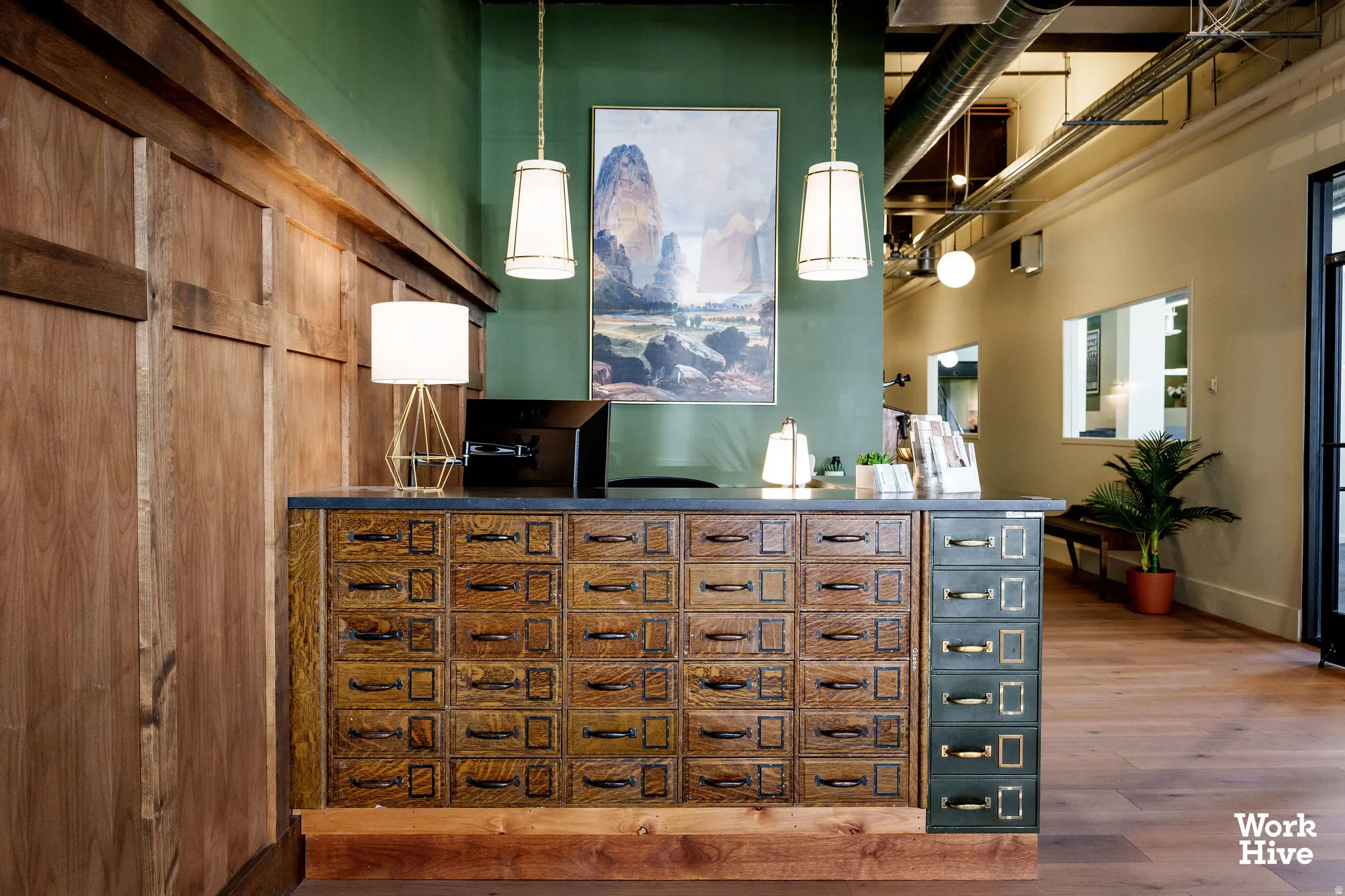 Bar area featuring dark countertops and decorative light fixtures