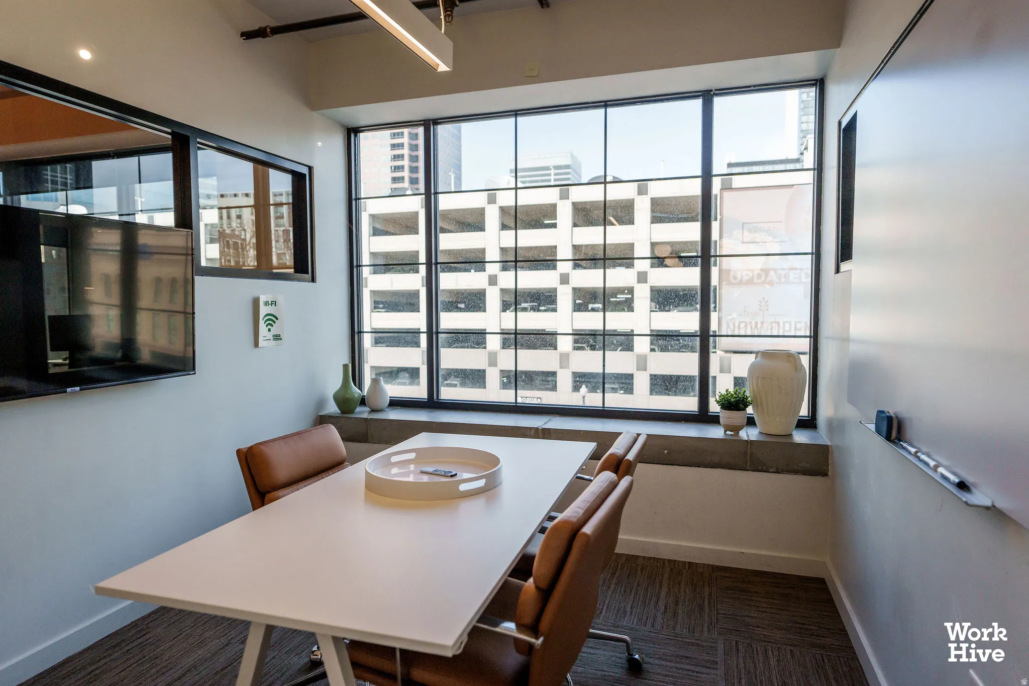 Dining room featuring healthy amount of natural light and dark carpet