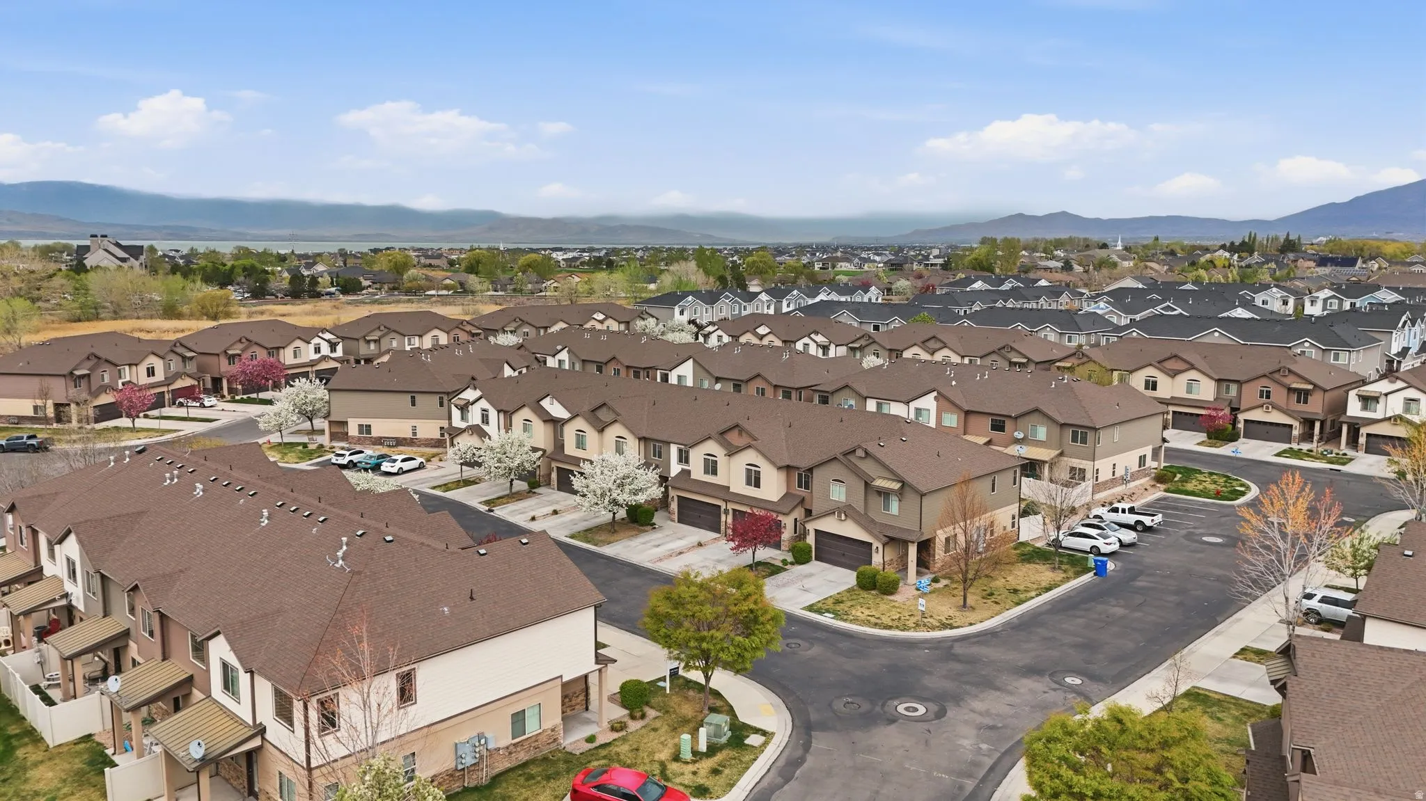 Aerial view of residential area featuring a mountain backdrop