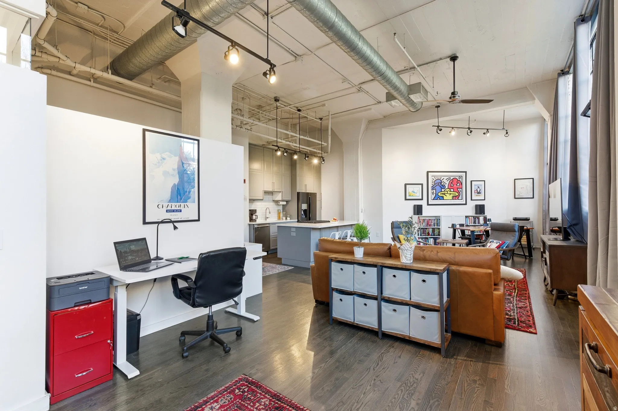 Home office with a high ceiling, a ceiling fan, and rail lighting