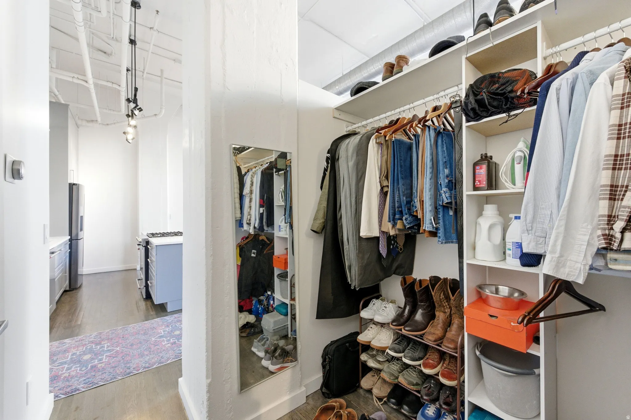 Walk in closet featuring light wood-style floors