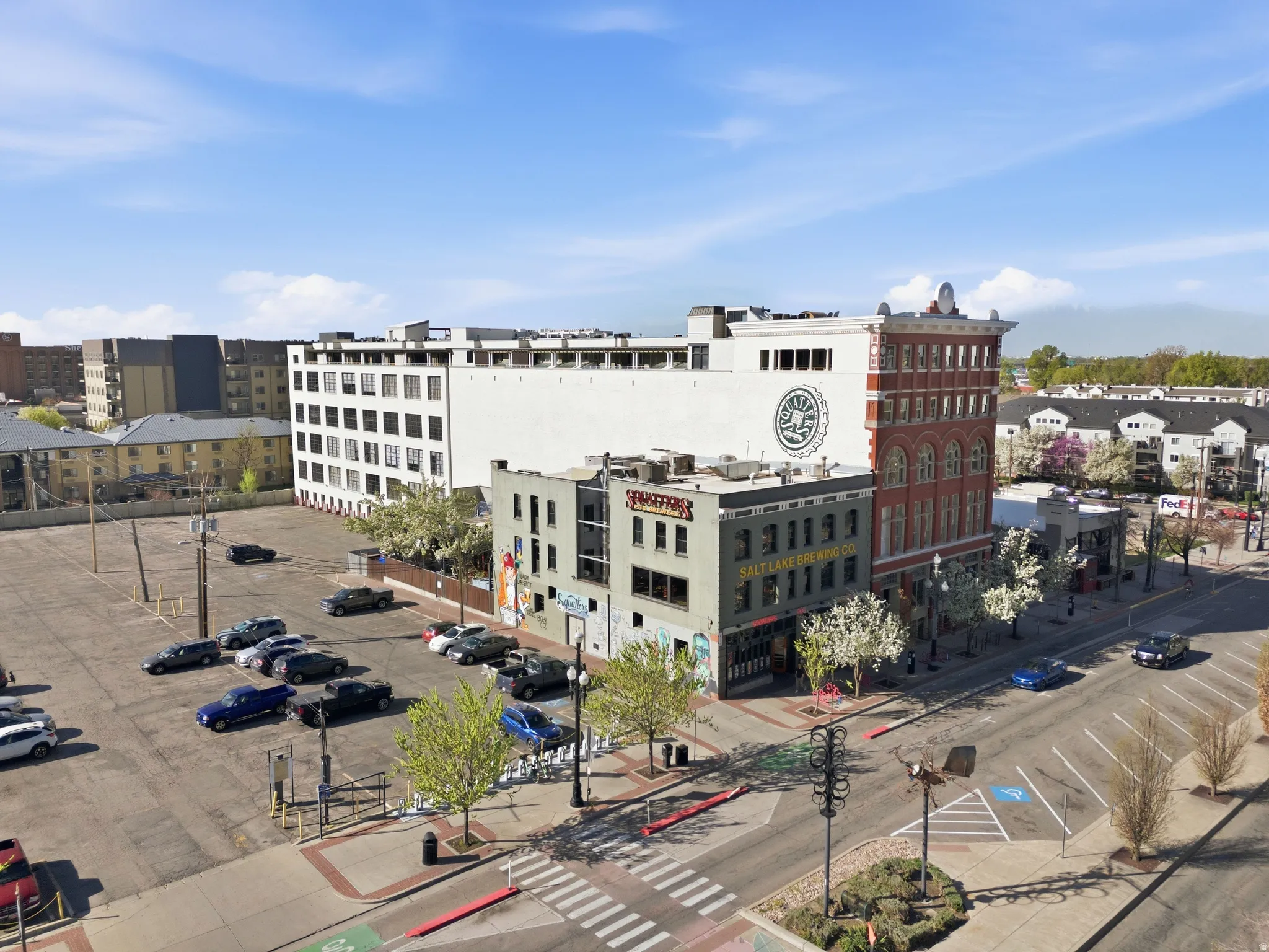 View of property featuring uncovered parking