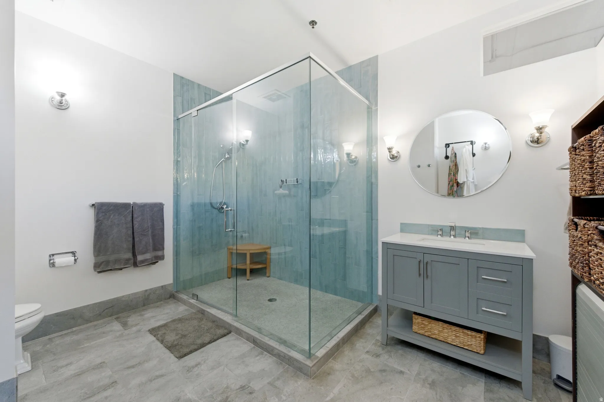 Full bath featuring vanity and a shower stall