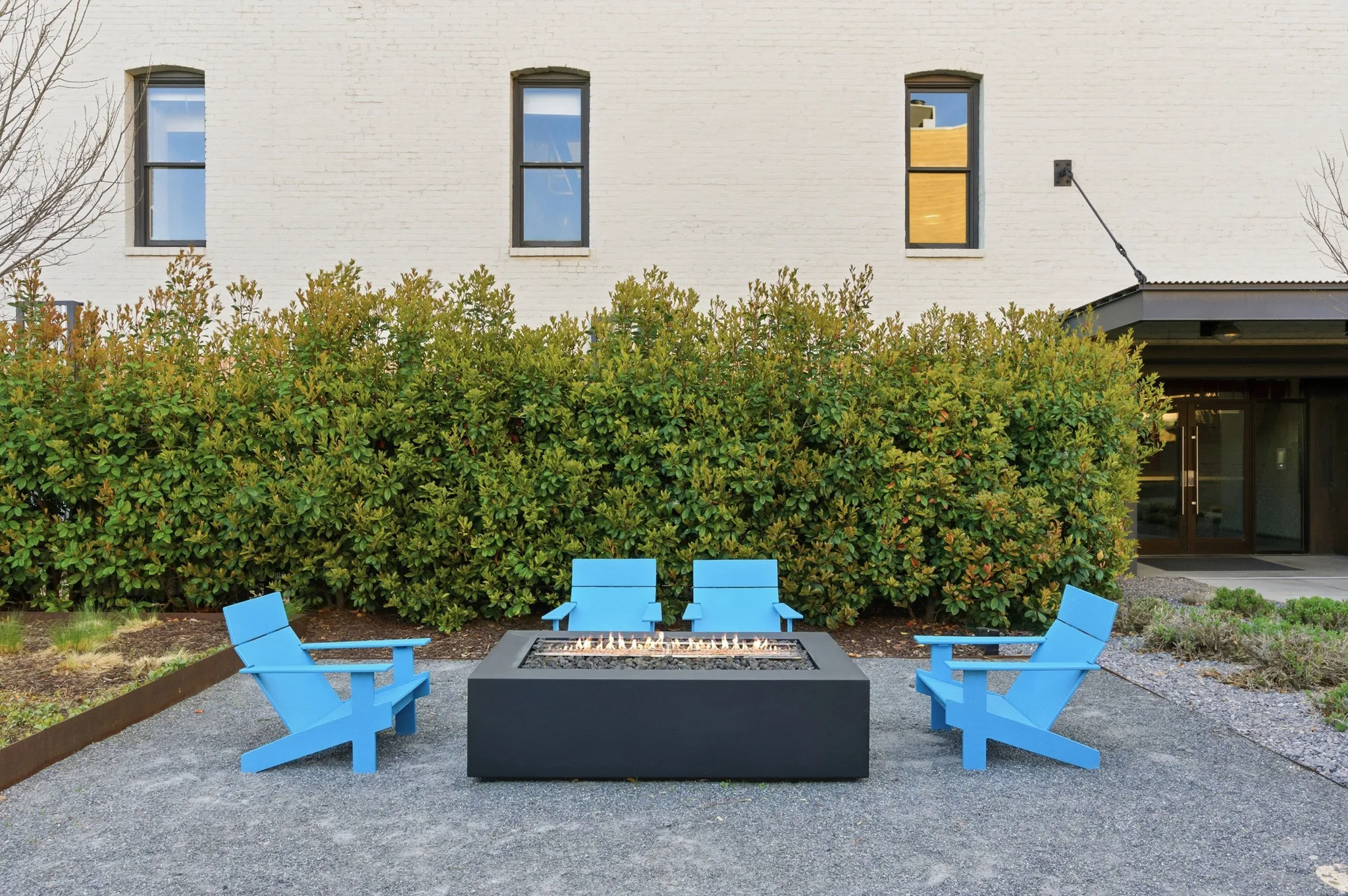 View of patio with an outdoor fire pit