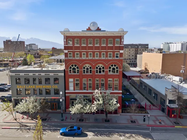 View of building exterior with a city view and a mountain view