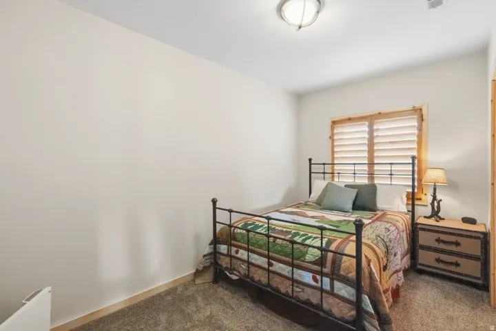 Bedroom with dark carpet