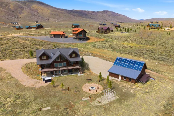 Aerial view of sparsely populated area featuring a mountain backdrop