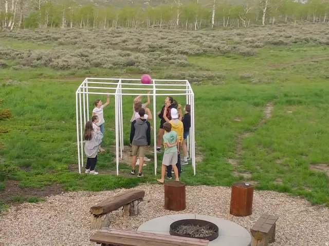 View of home's community with an outdoor fire pit
