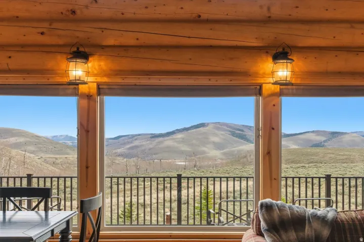 Sunroom featuring a mountain view