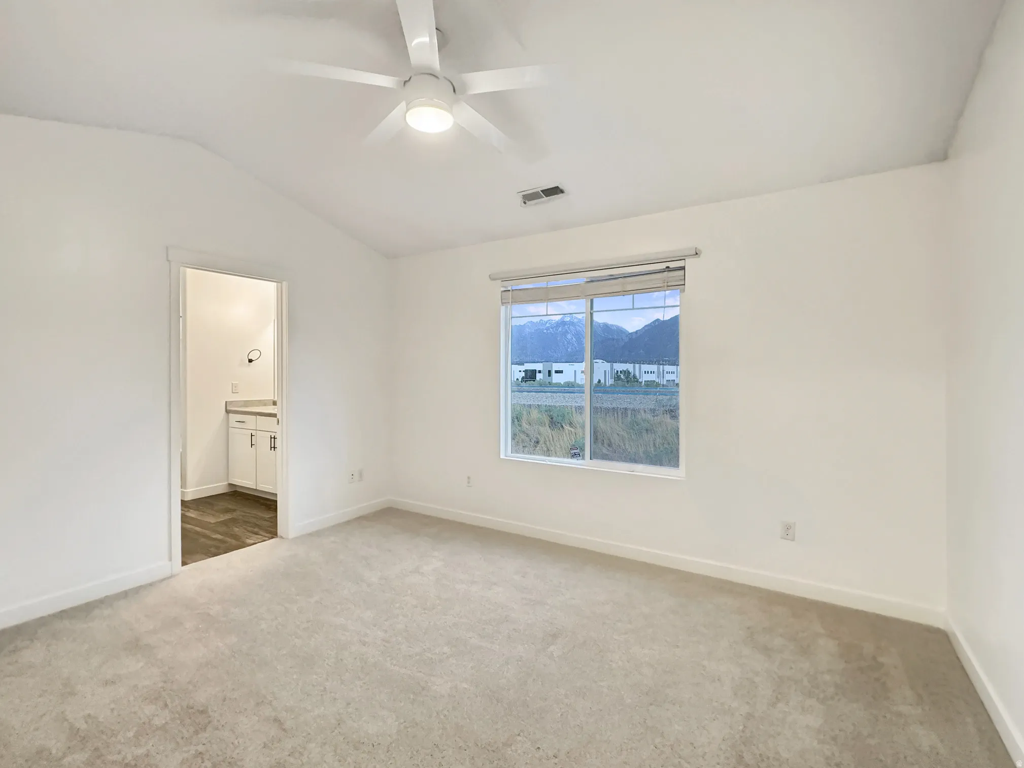 Master Bedroom with connected bath and view of the Wasatch Mountains.