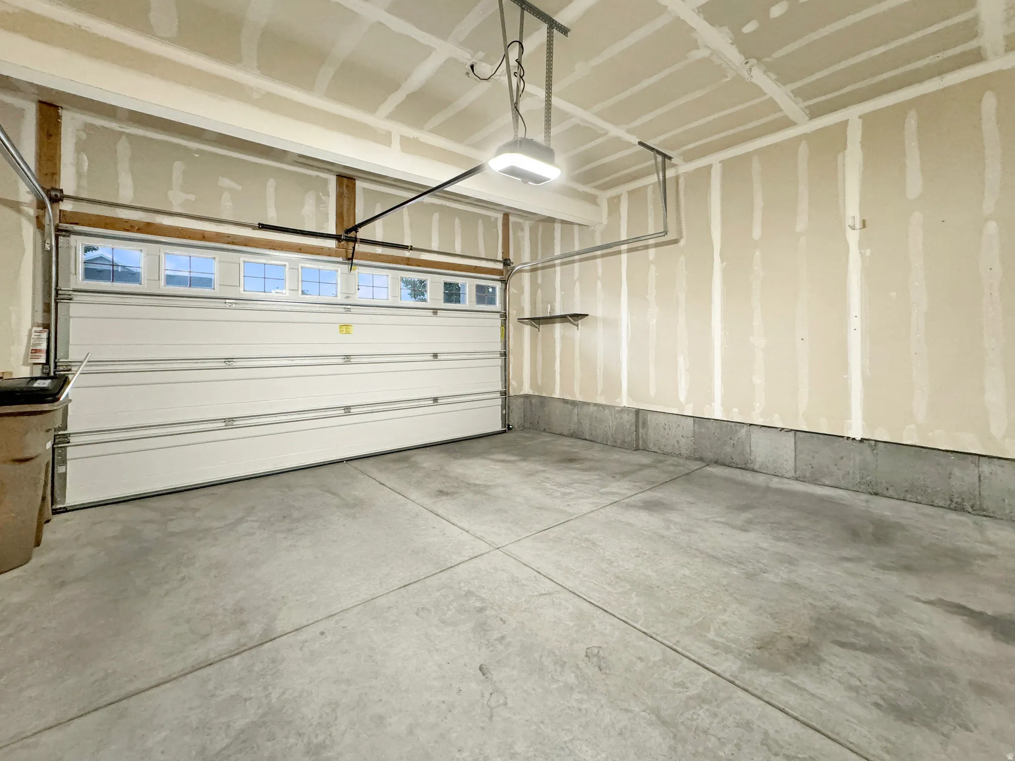 Oversized garage with tall ceilings for storage racks.