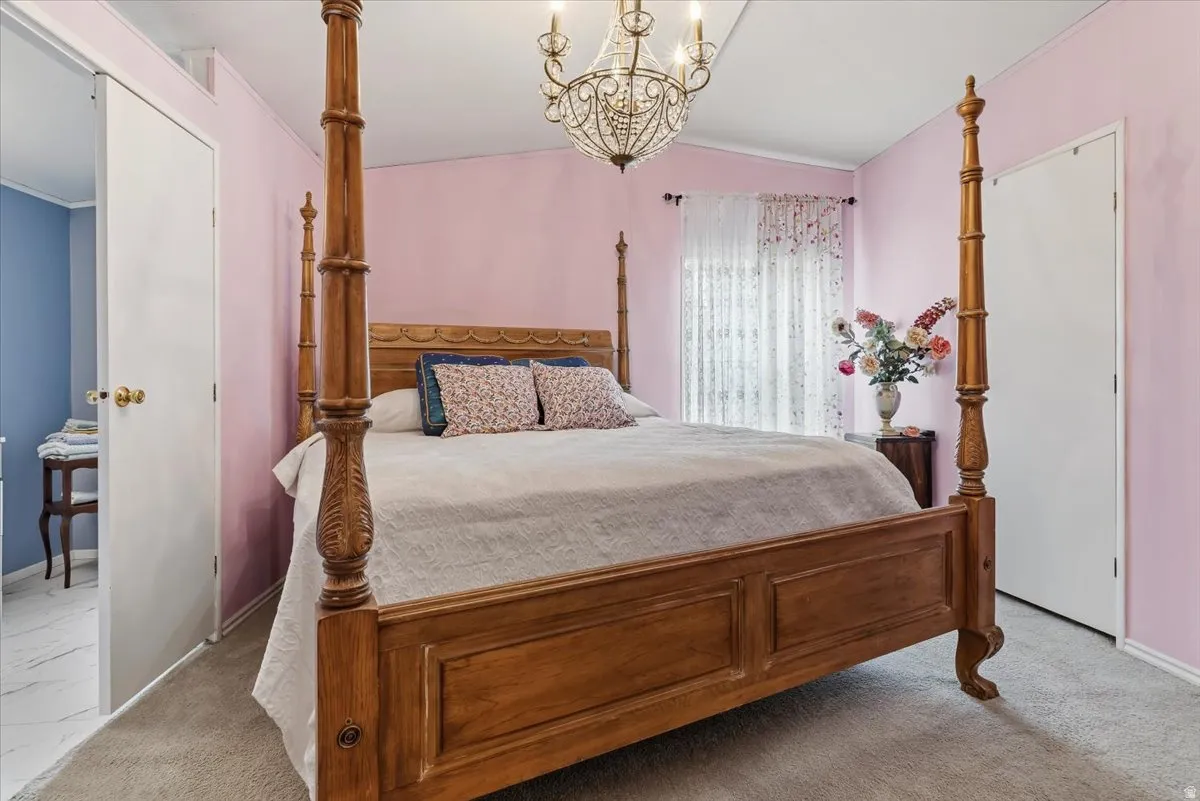 Bedroom featuring  light colored carpet