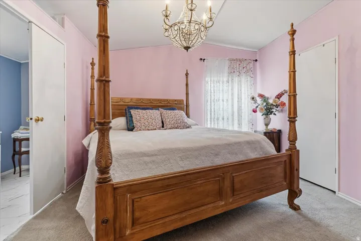 Bedroom featuring  light colored carpet