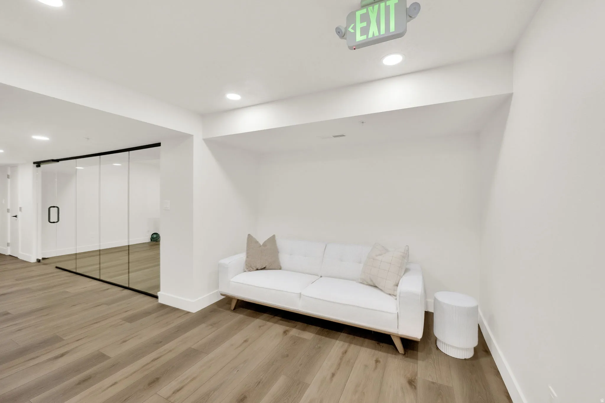 Sitting room featuring light wood-style floors and recessed lighting