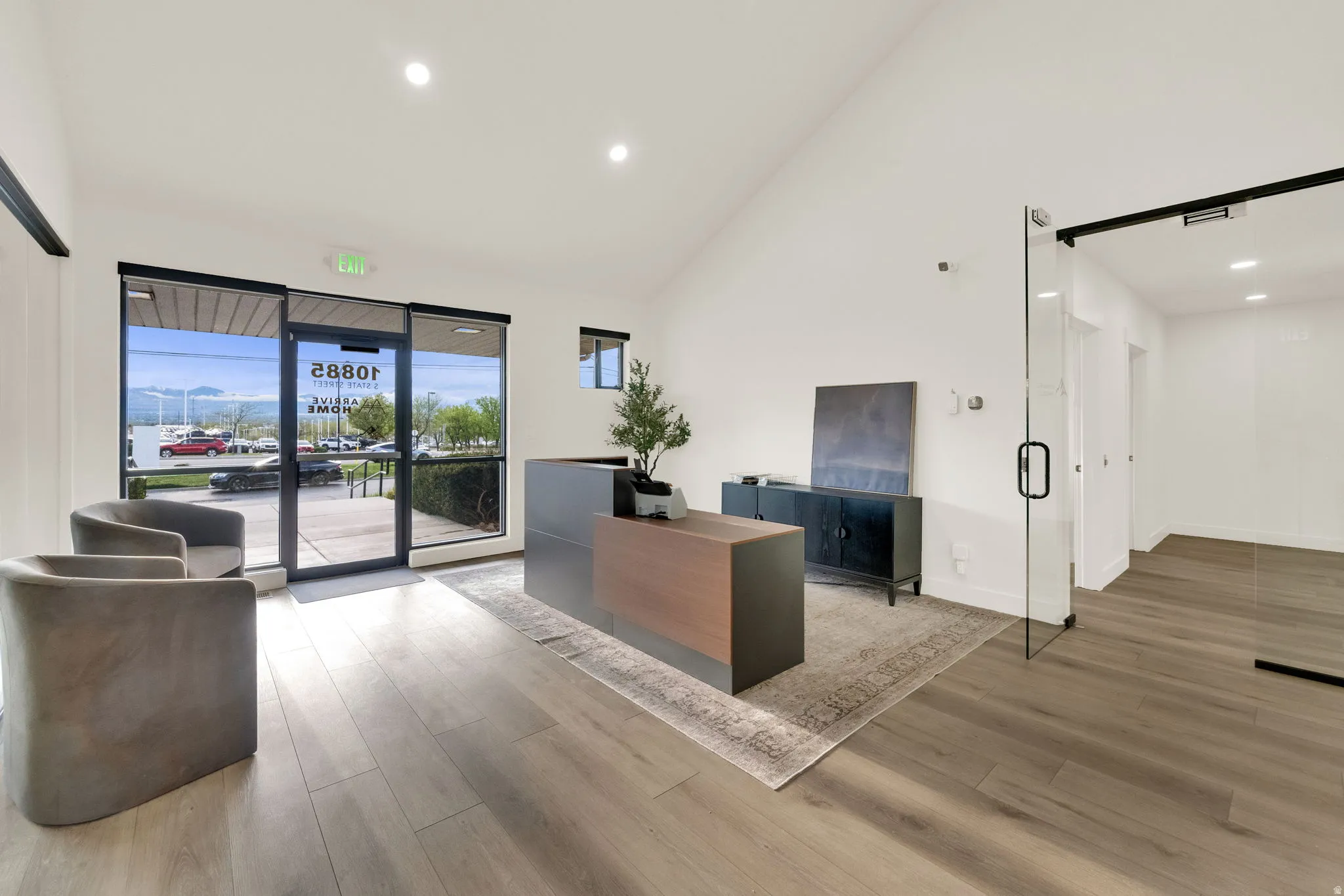 Office space with lofted ceiling and recessed lighting