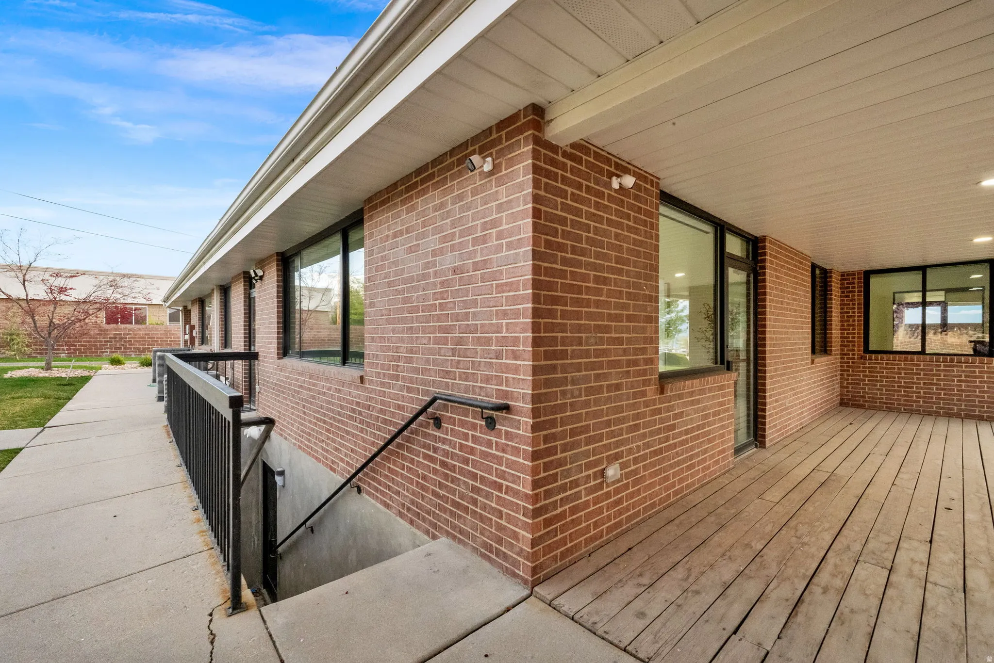 View of side of property featuring brick siding