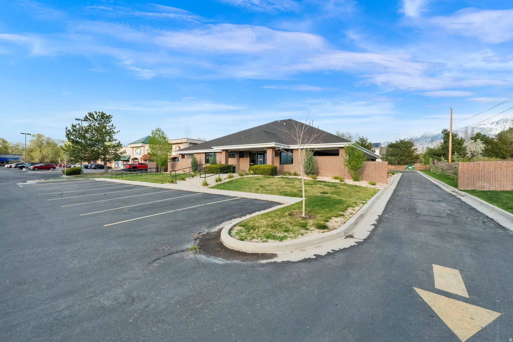 View of asphalt road featuring curbs