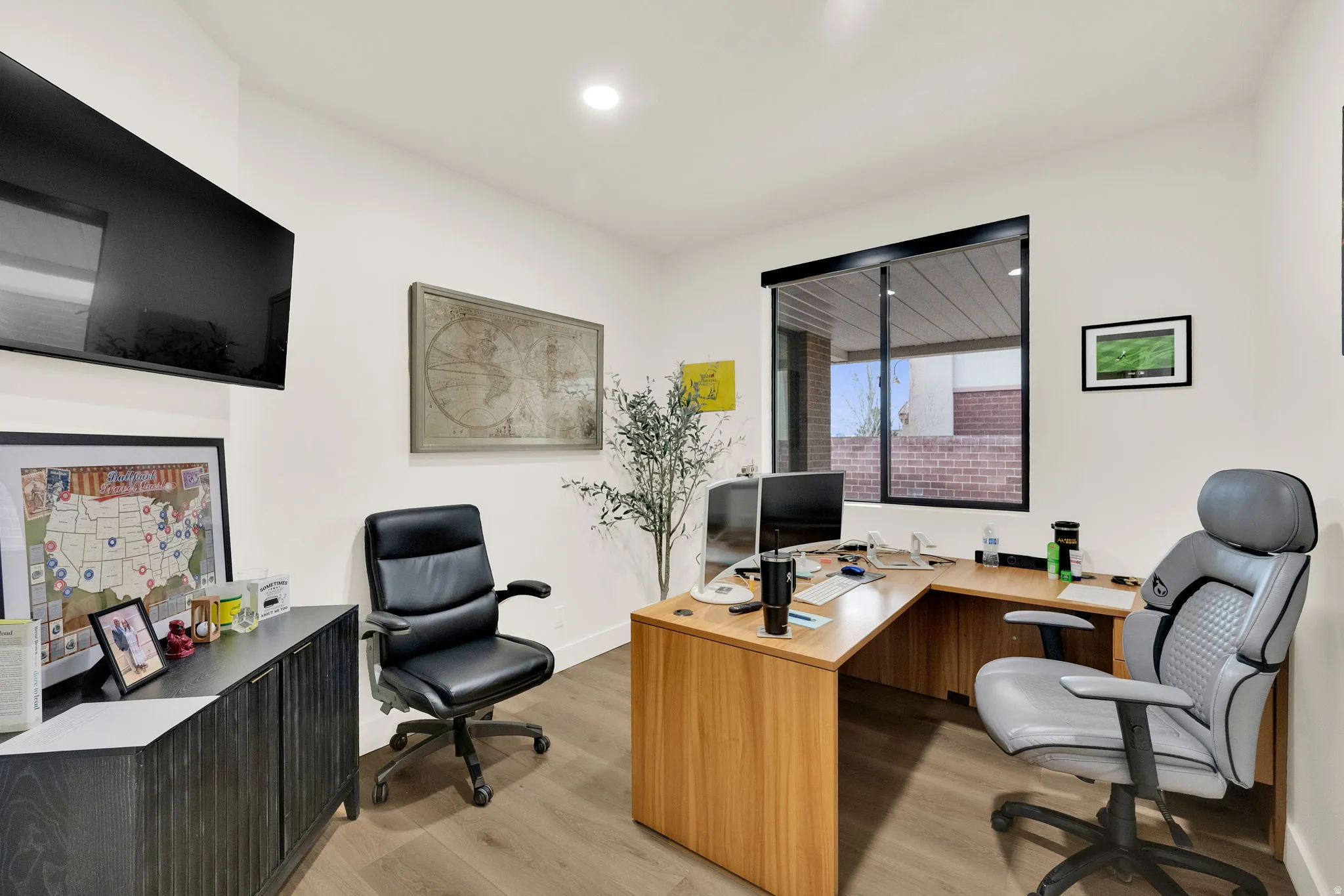 Home office featuring light wood finished floors and recessed lighting