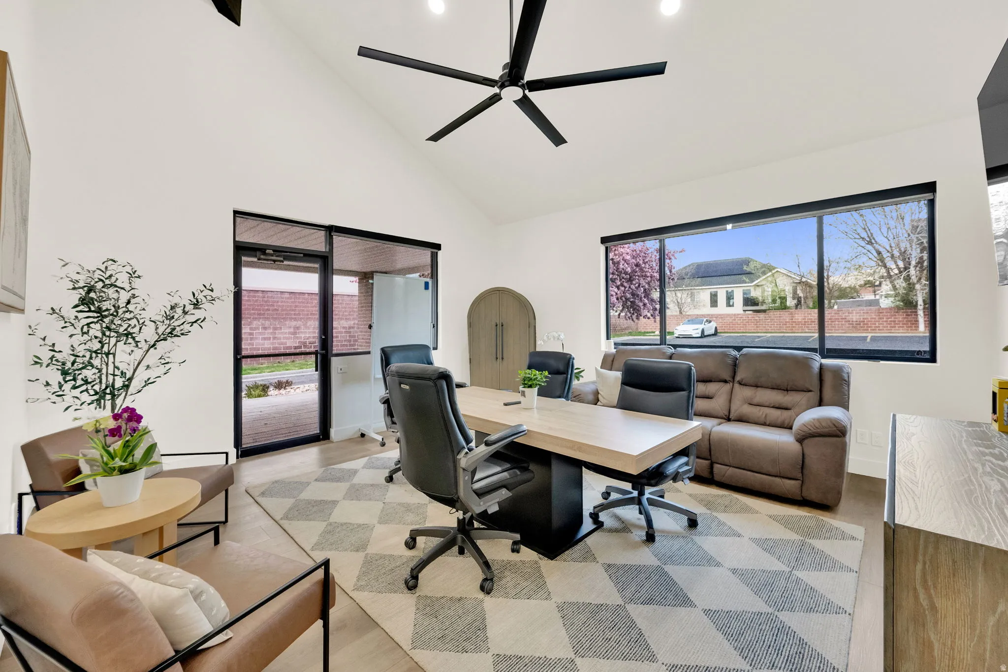 Office area featuring vaulted ceiling, ceiling fan, and recessed lighting