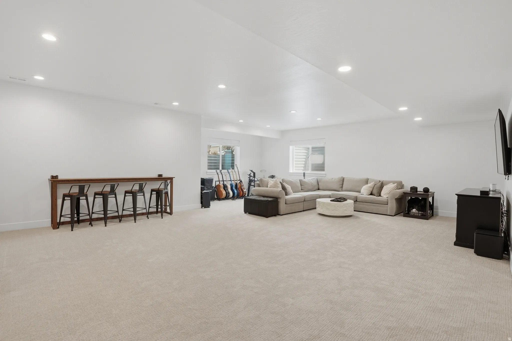 Living room featuring light carpet and recessed lighting