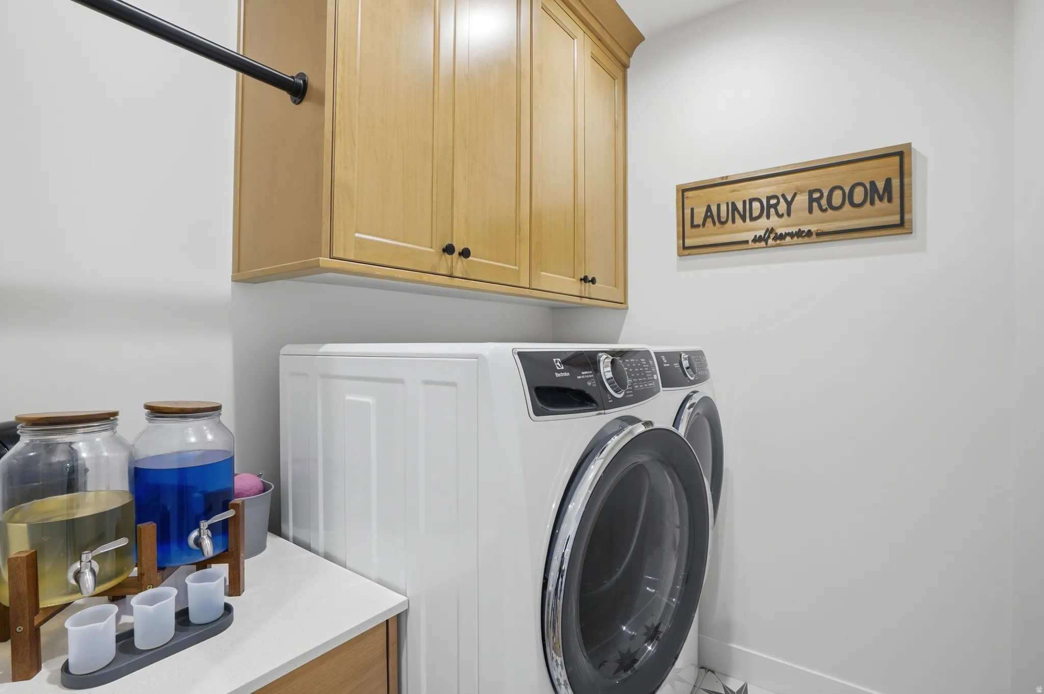 Laundry area with cabinet space