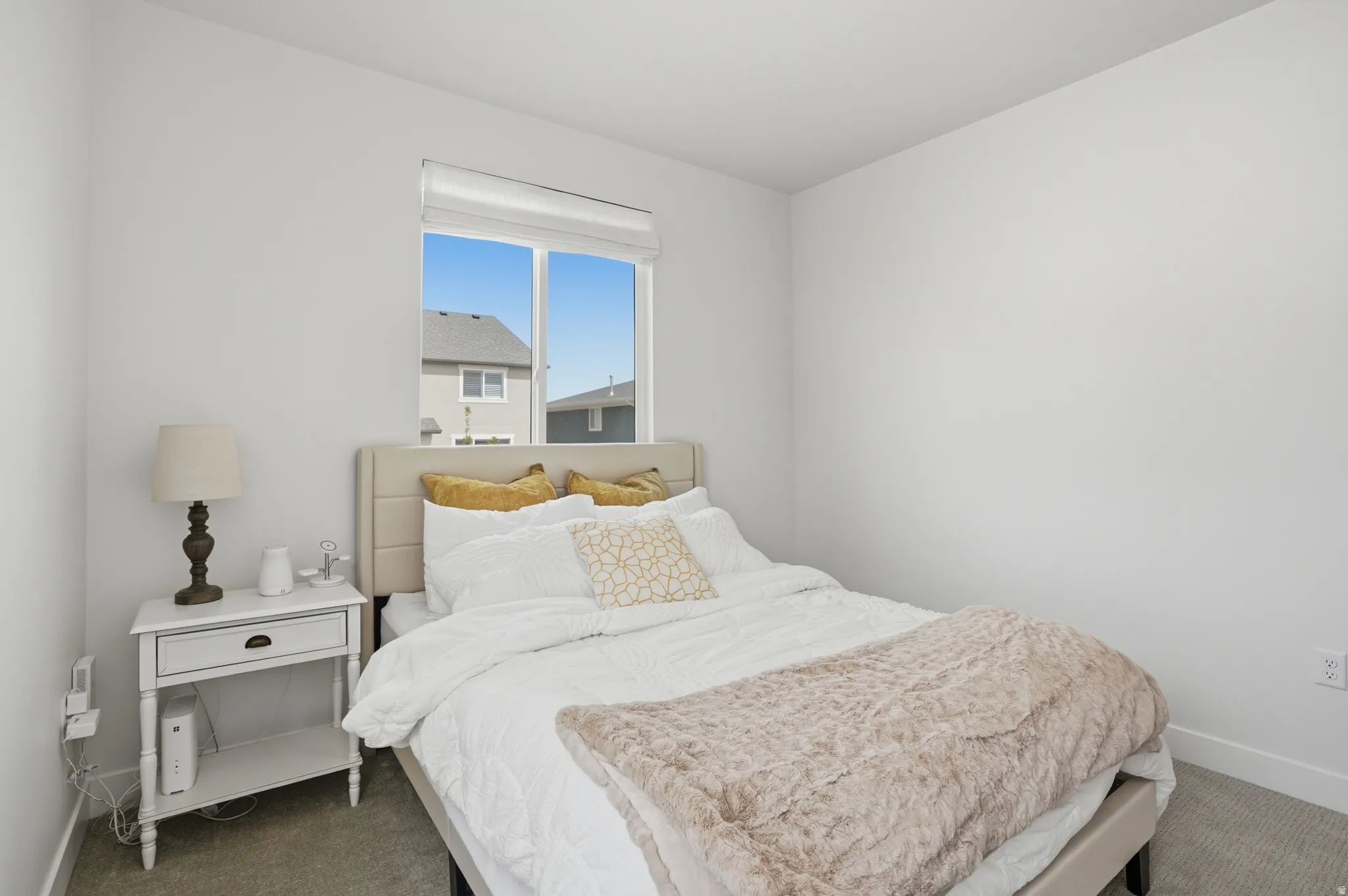 Carpeted bedroom with baseboards