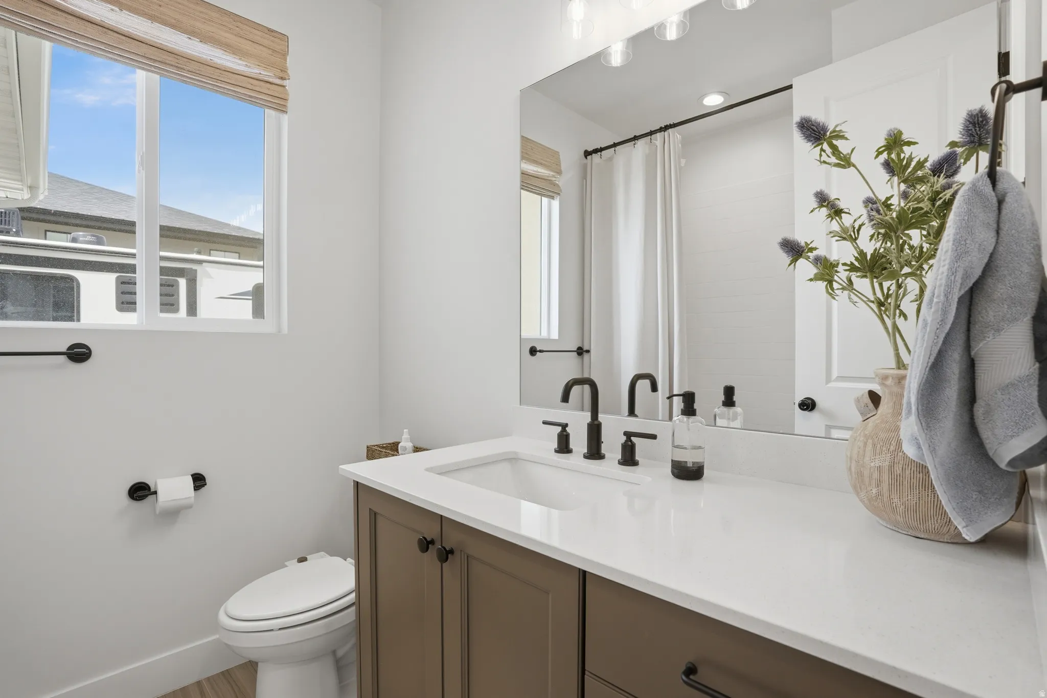 Full bath featuring a shower with shower curtain and vanity