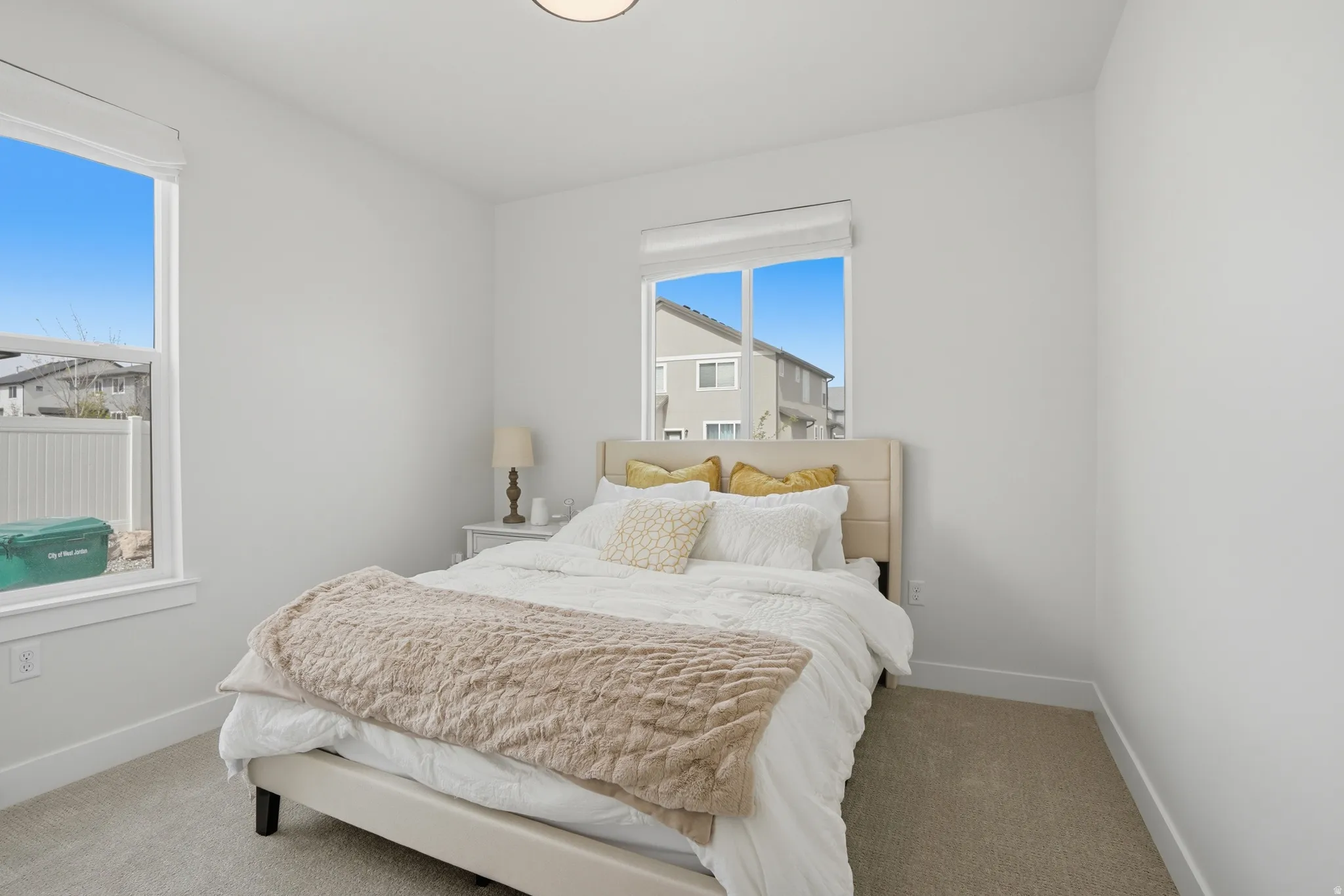 Carpeted bedroom featuring baseboards