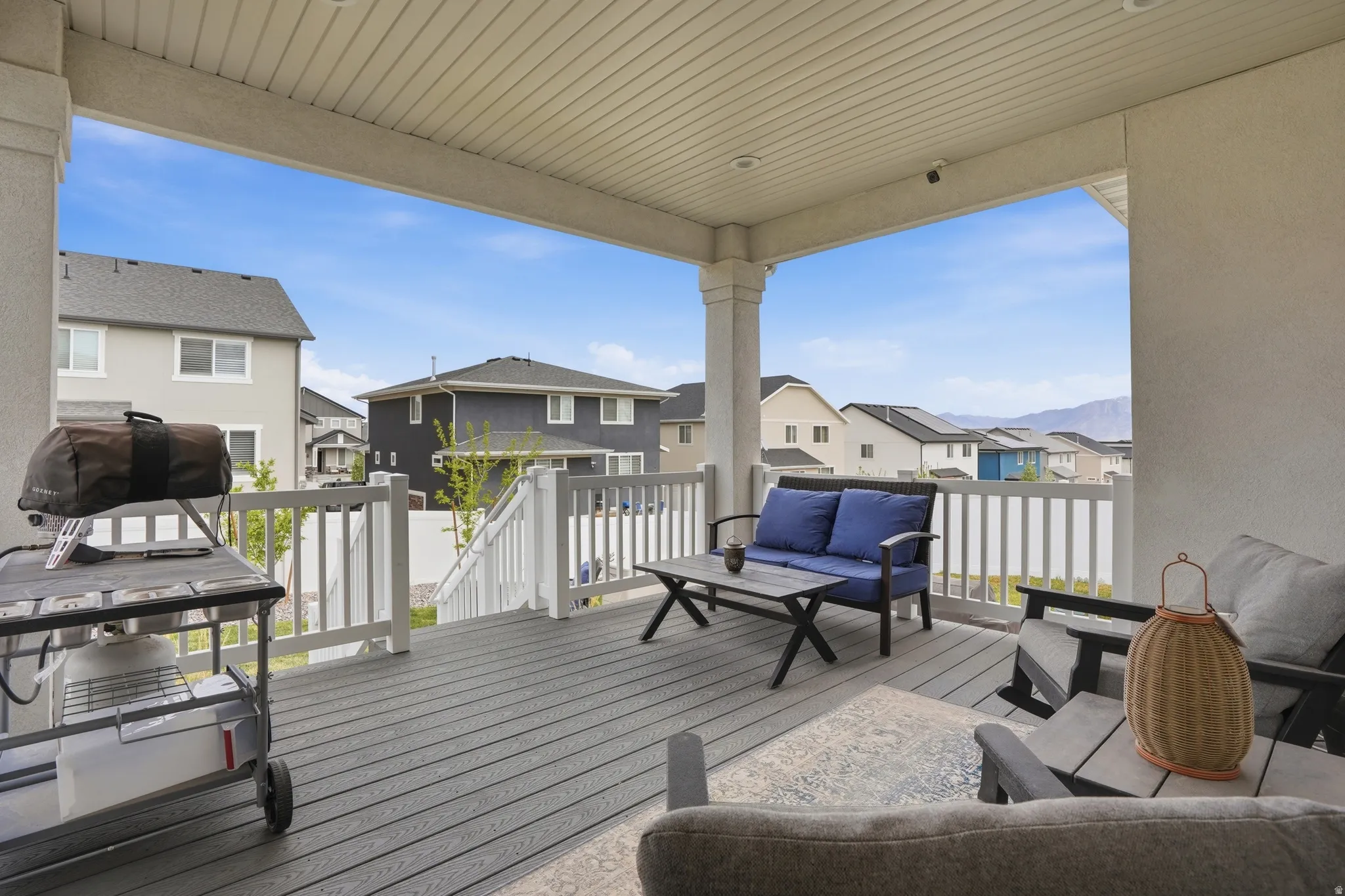 Deck featuring an outdoor hangout area, a residential view, and area for grilling