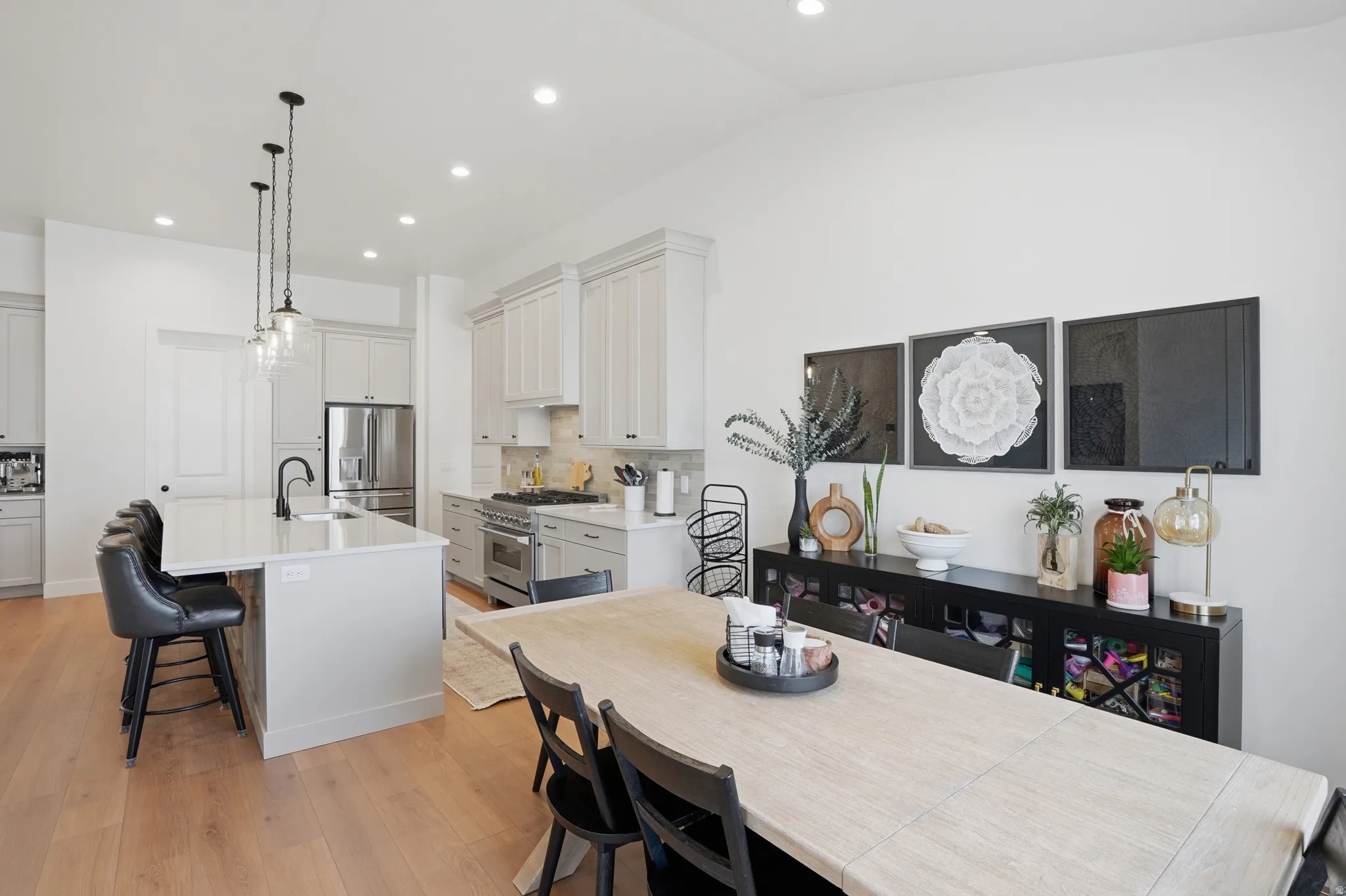 Dining room featuring light wood-type flooring and recessed lighting
