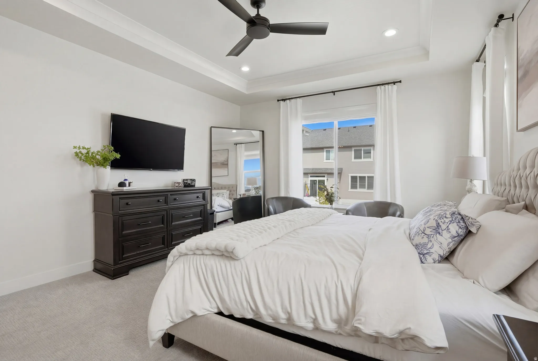 Bedroom featuring a ceiling fan, light carpet, recessed lighting, and crown molding