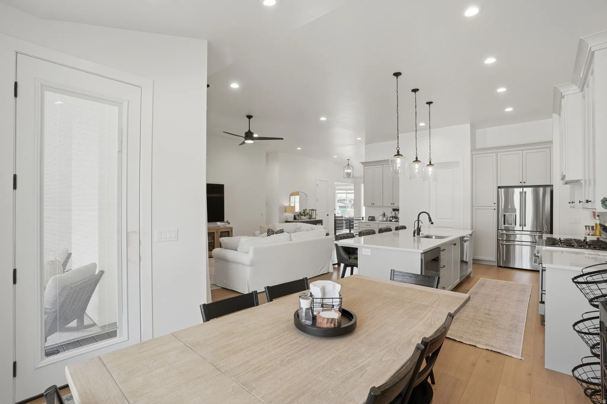 Dining space featuring light wood-type flooring, recessed lighting, and ceiling fan