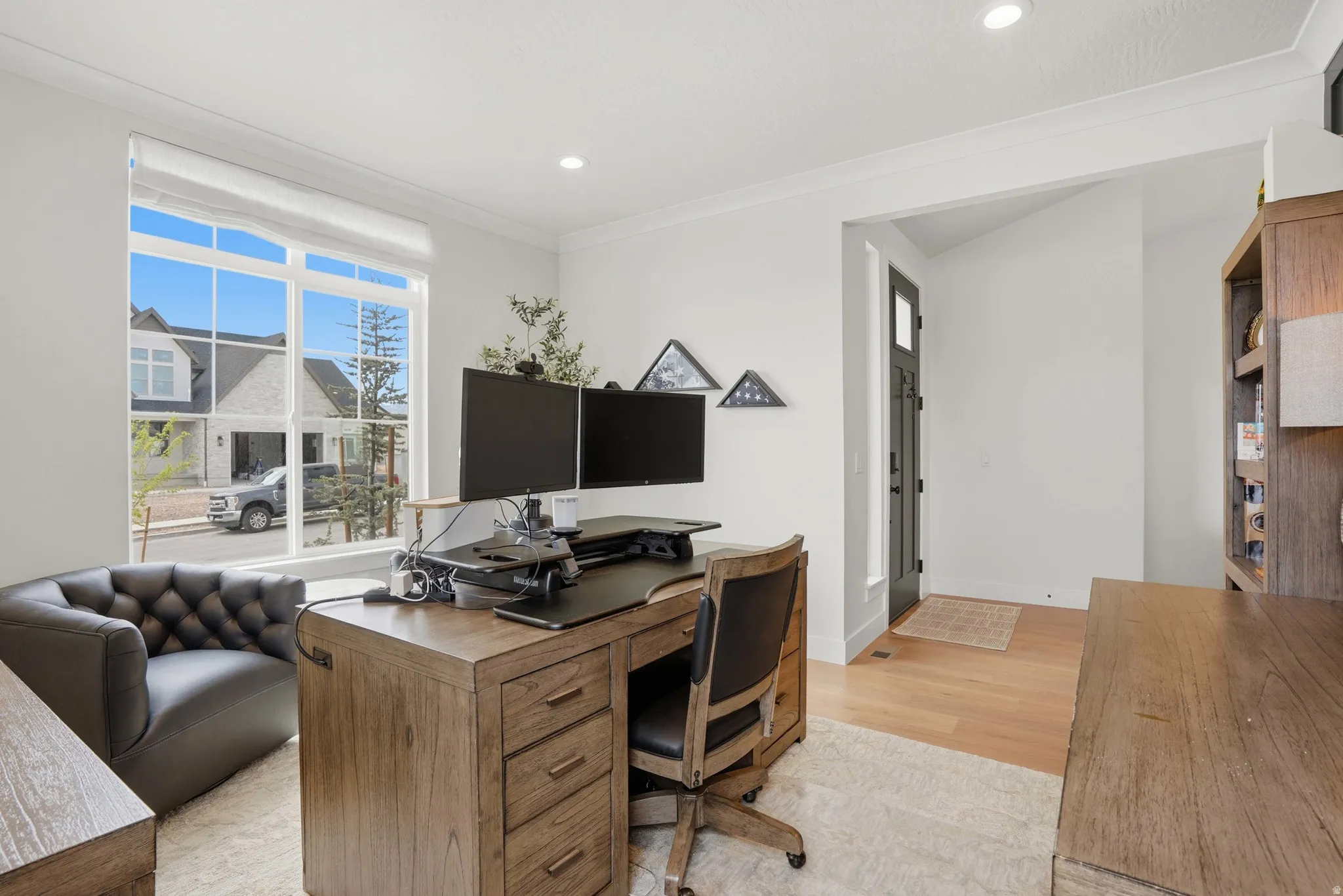 Office featuring light wood-style floors, ornamental molding, and recessed lighting