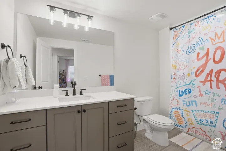 Bathroom featuring vanity and a shower with shower curtain