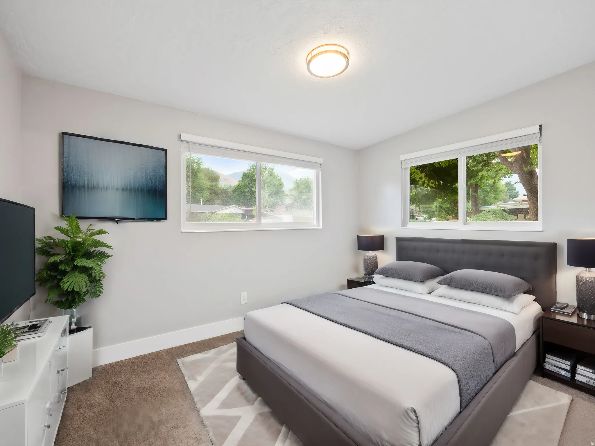 Bedroom with baseboards and light carpet