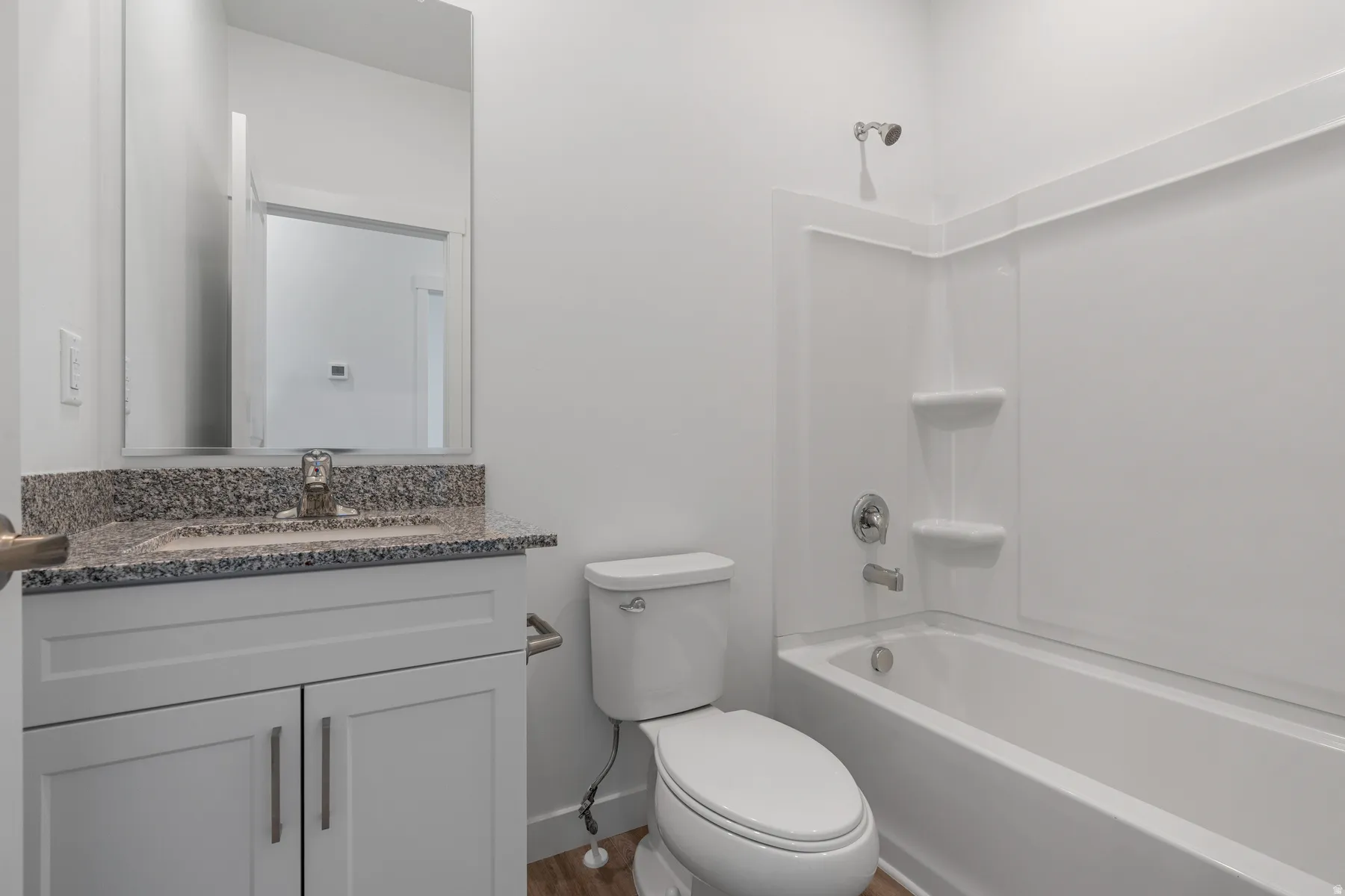 Full bath with vanity and shower / washtub combination