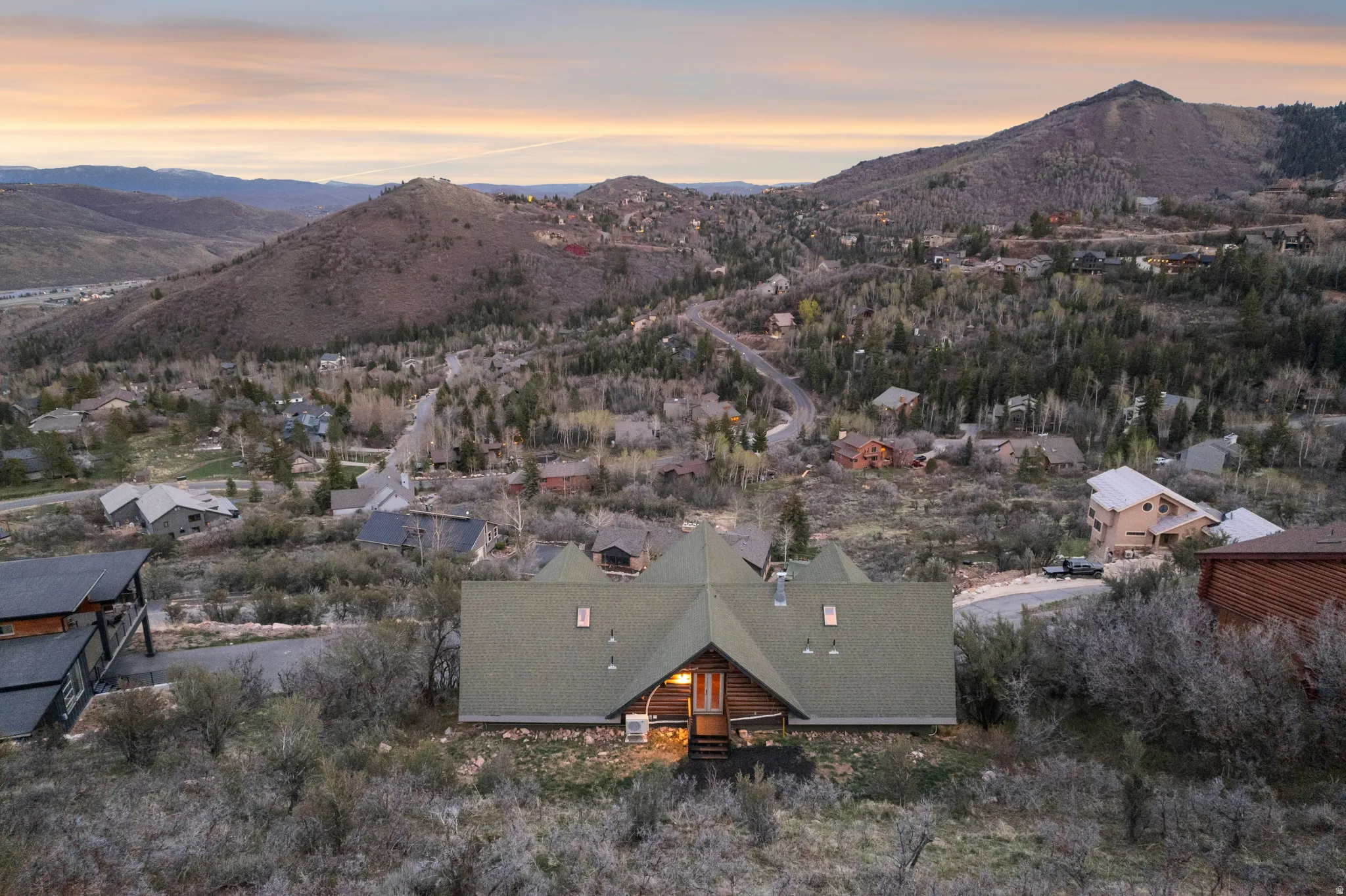 Aerial view of property and surrounding area with mountains