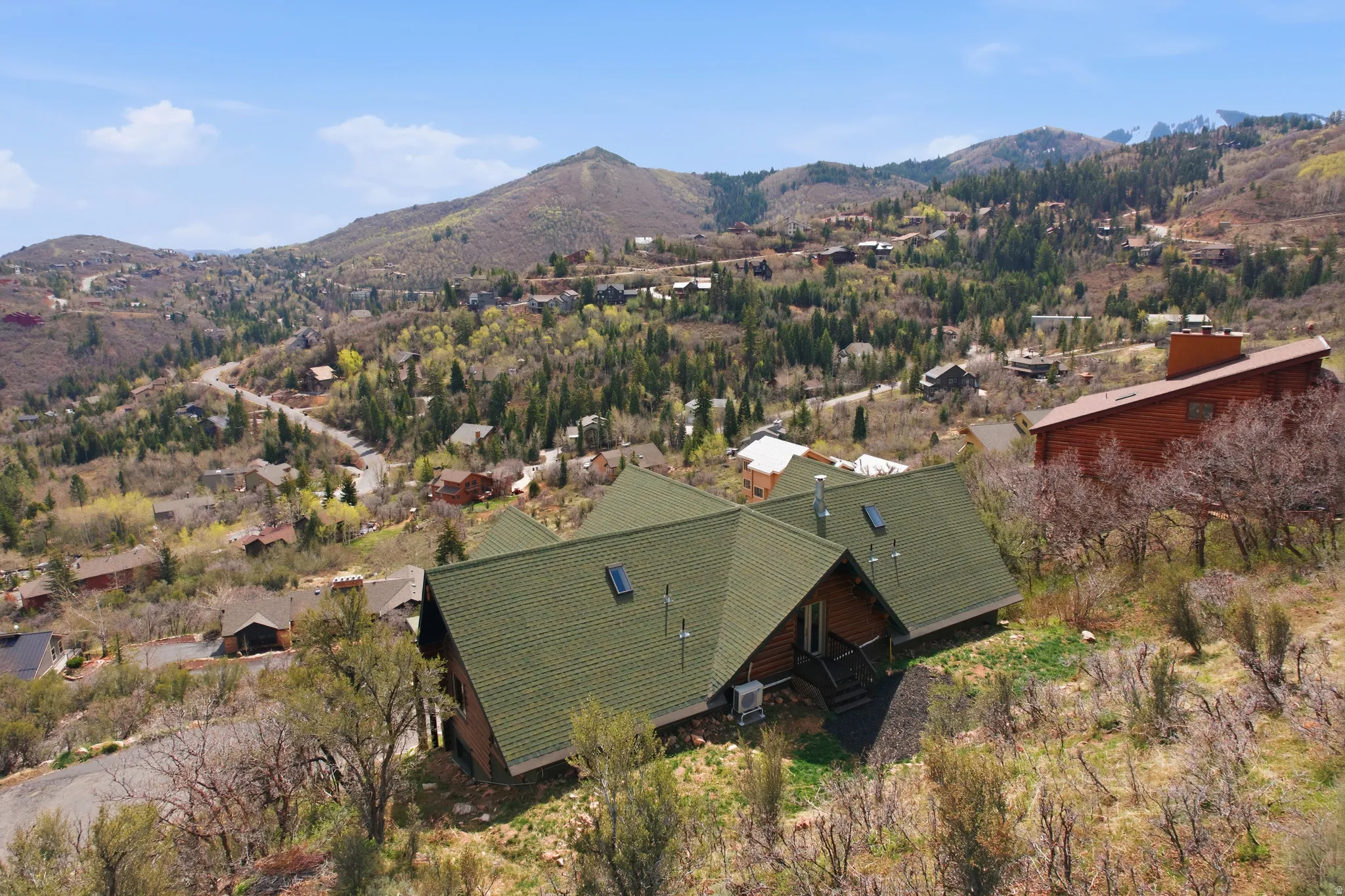 View of subject property featuring a mountainous background