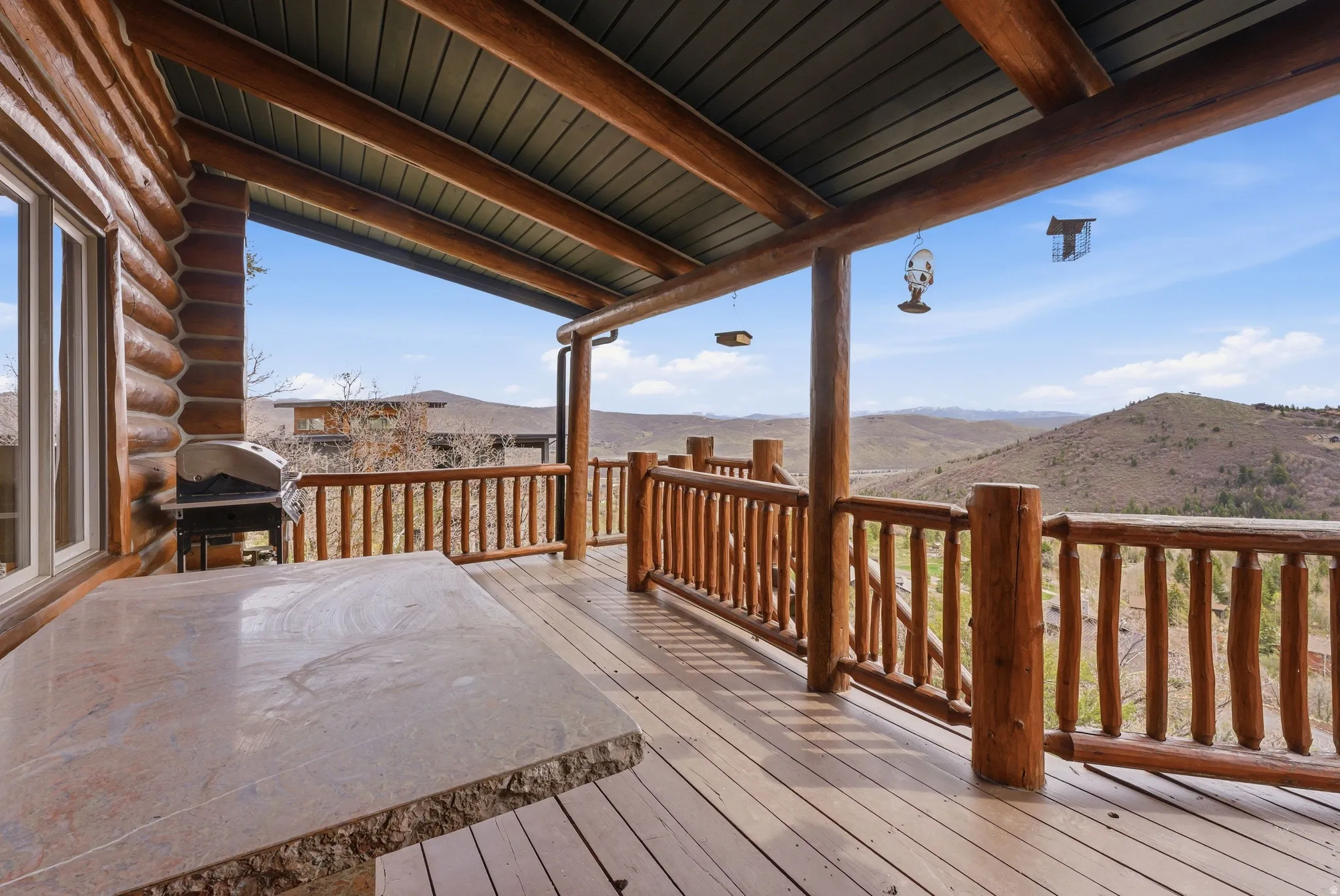 Deck with area for grilling and a mountain view