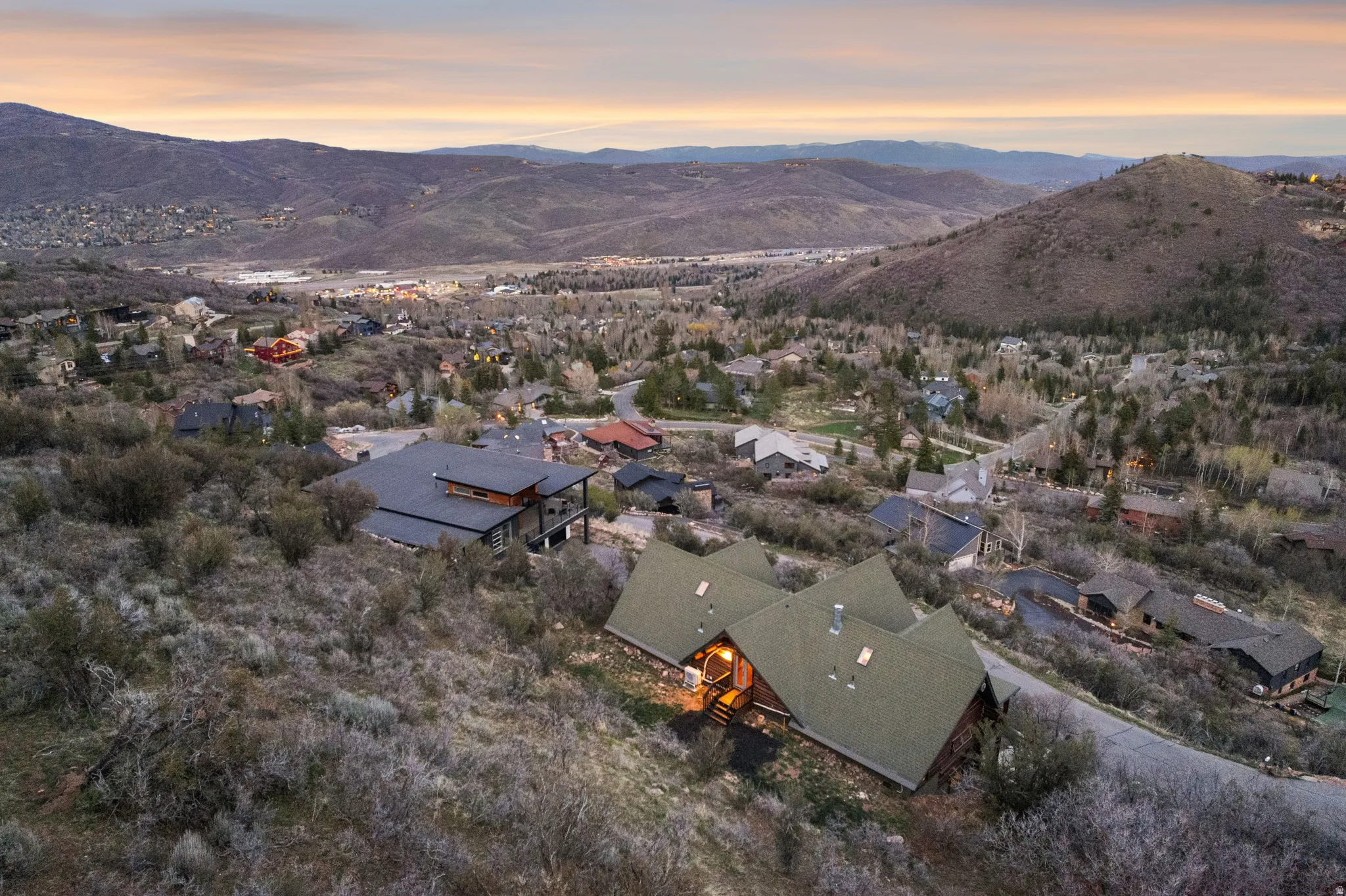Aerial view at dusk of a residential view and a mountain view
