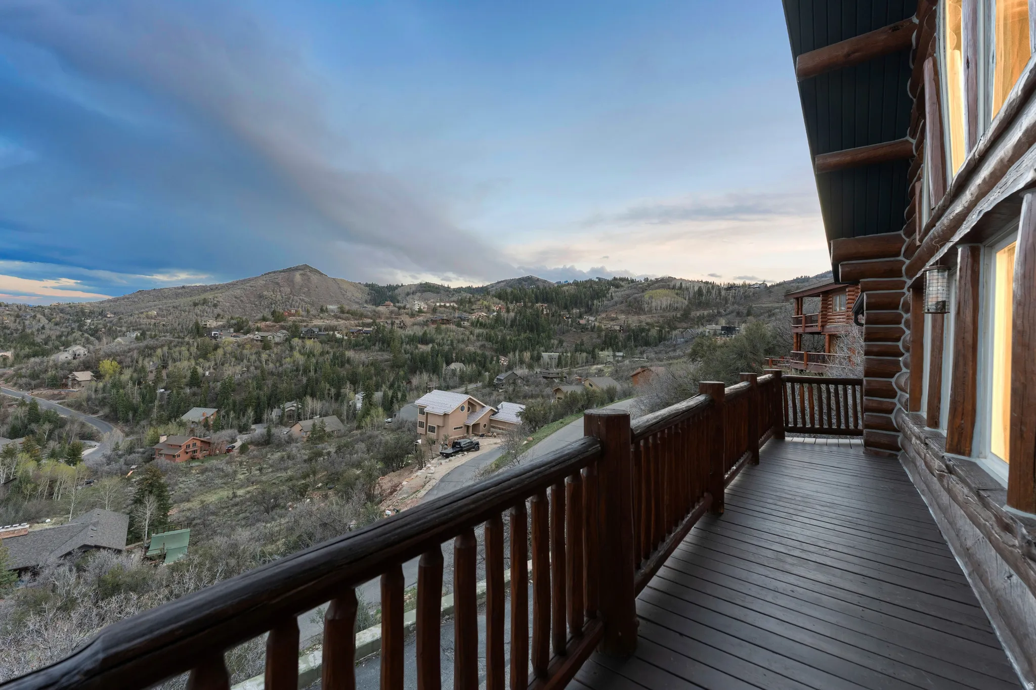 Balcony at dusk with a mountain view