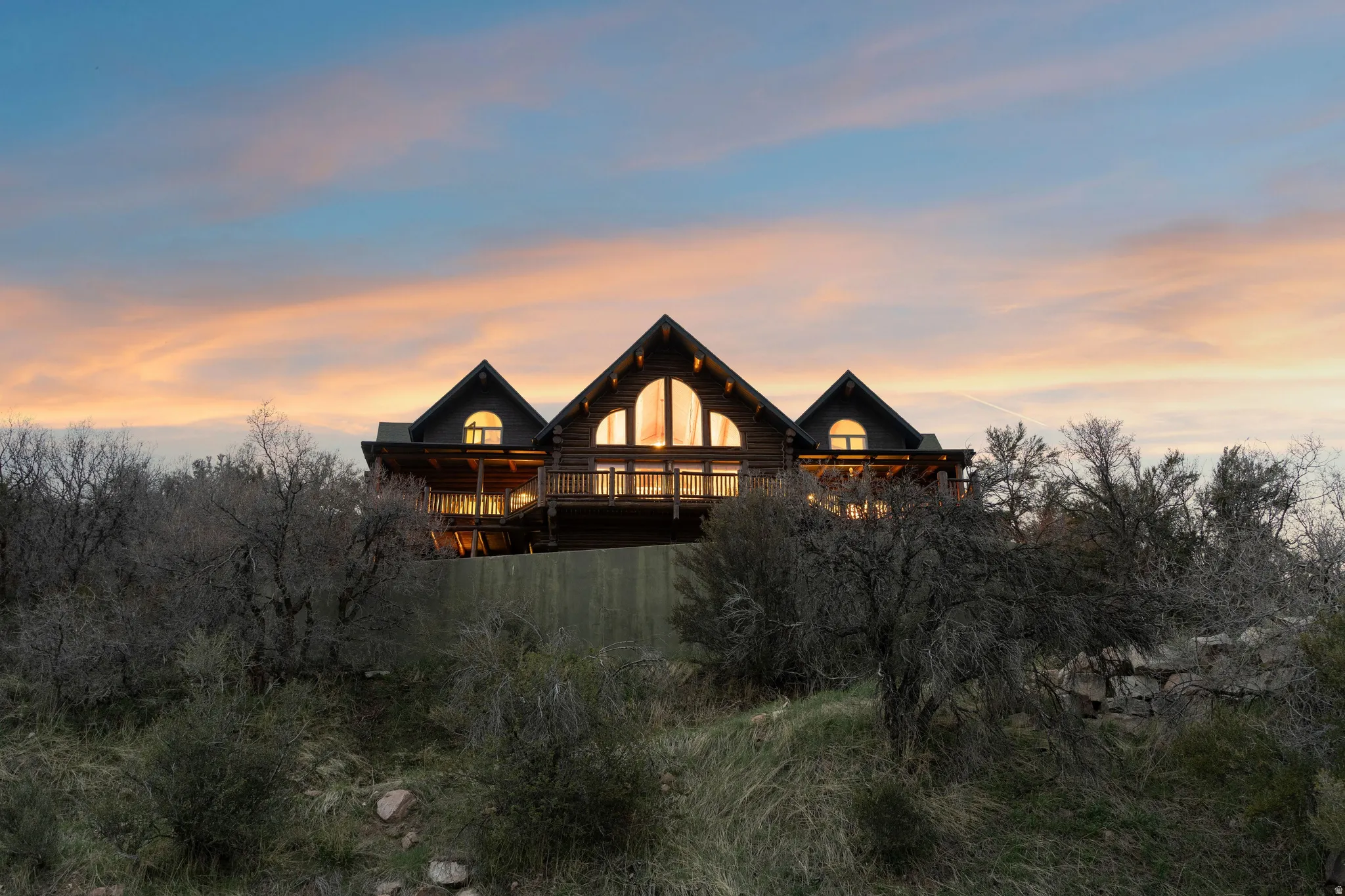 Back of property featuring log siding