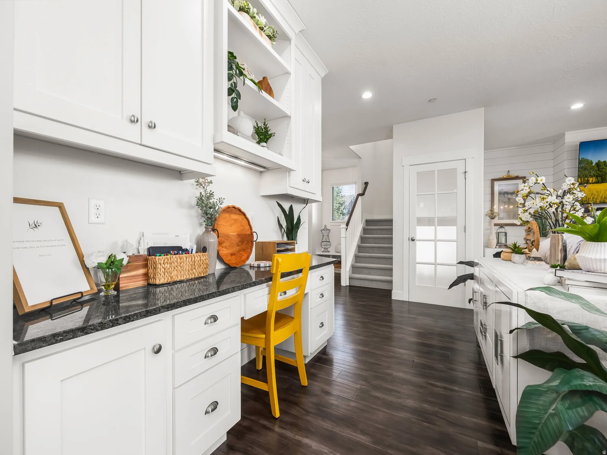 Kitchen featuring open shelves, dark wood-type flooring, white cabinets, dark stone counters, and recessed lighting