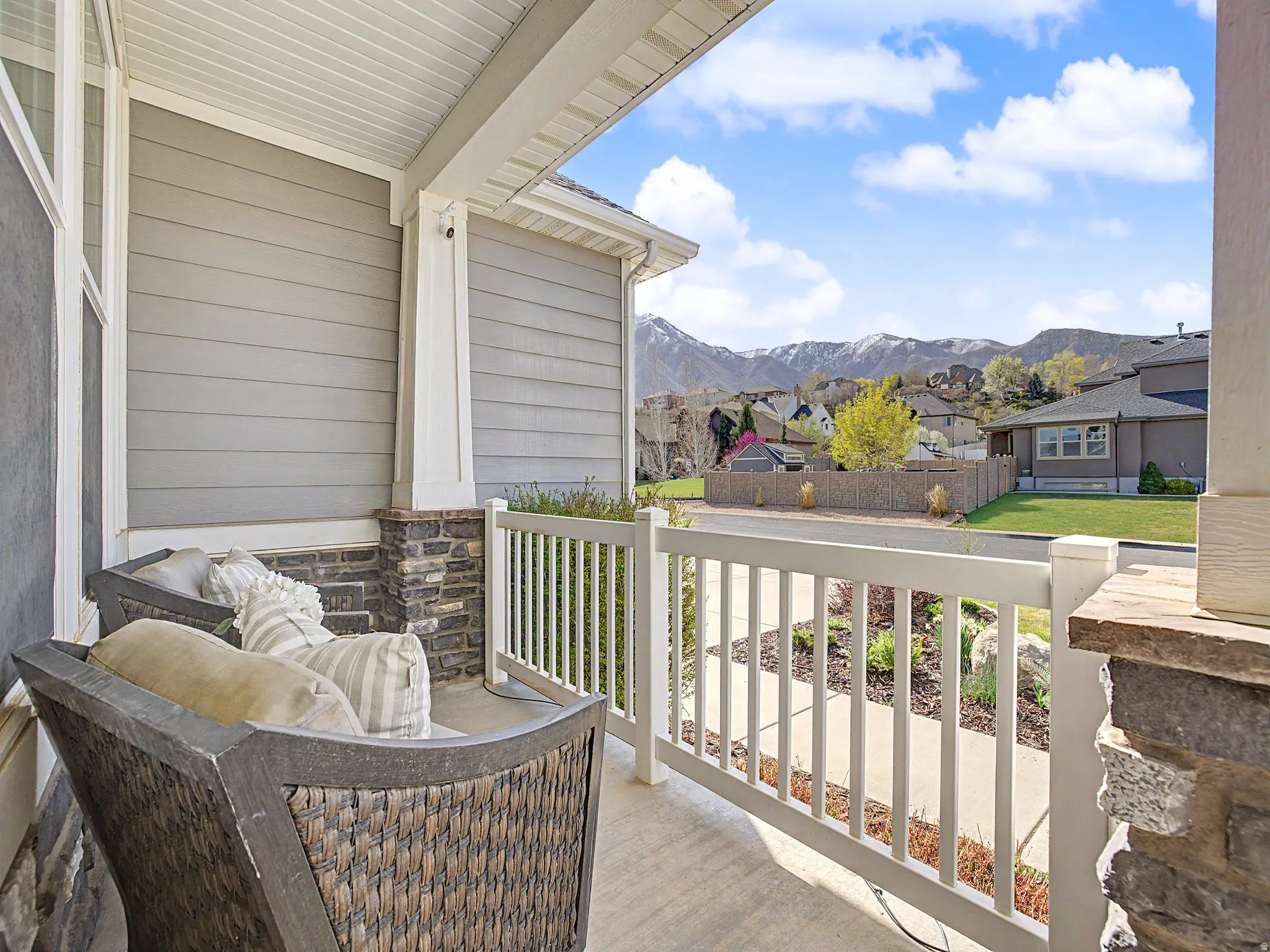 Porch featuring a residential view and a mountain view