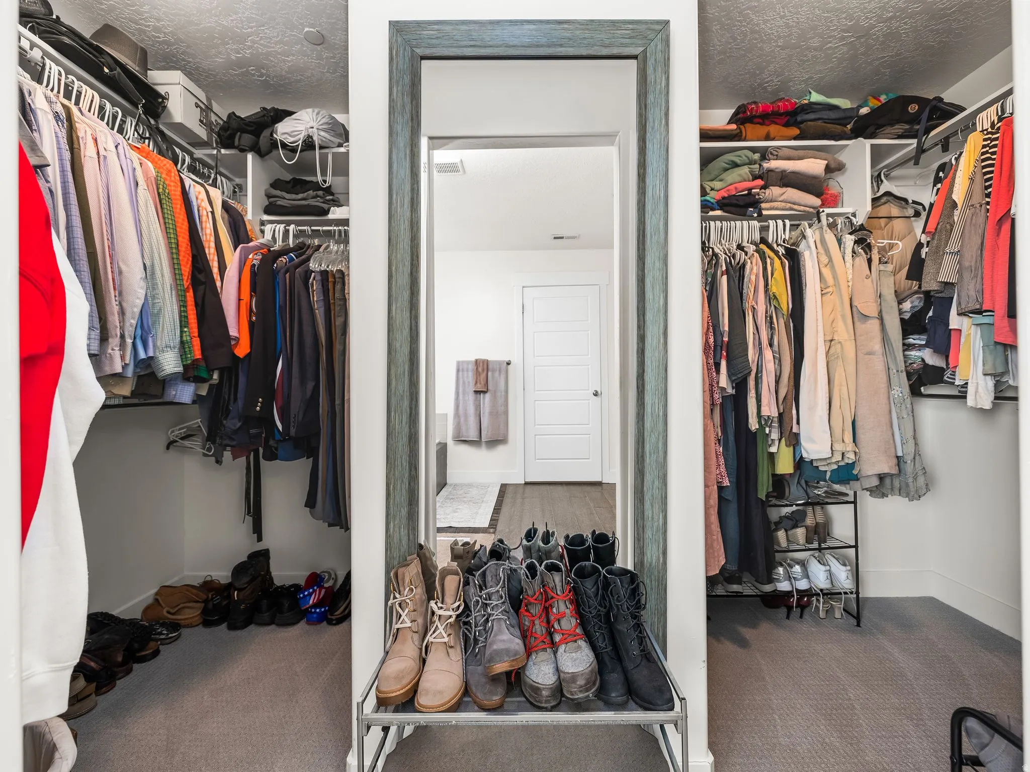 Walk in closet featuring carpet flooring