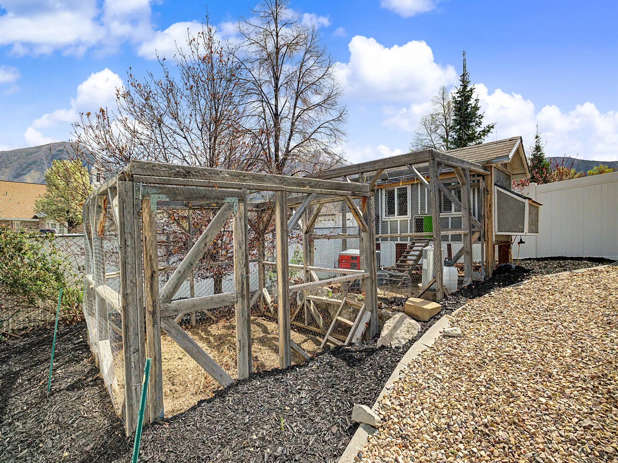 View of chicken coop with a mountain view