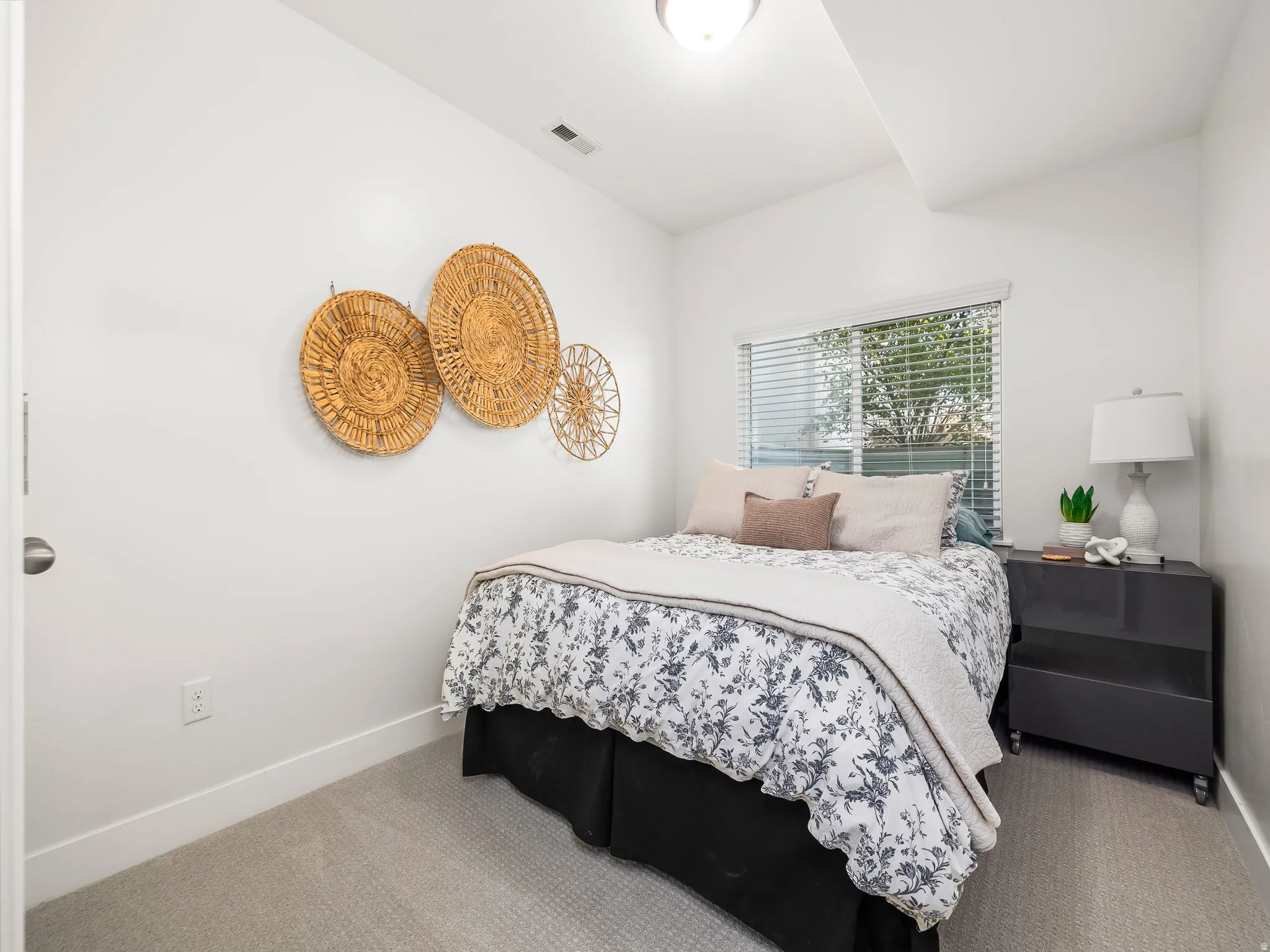 Carpeted bedroom featuring baseboards